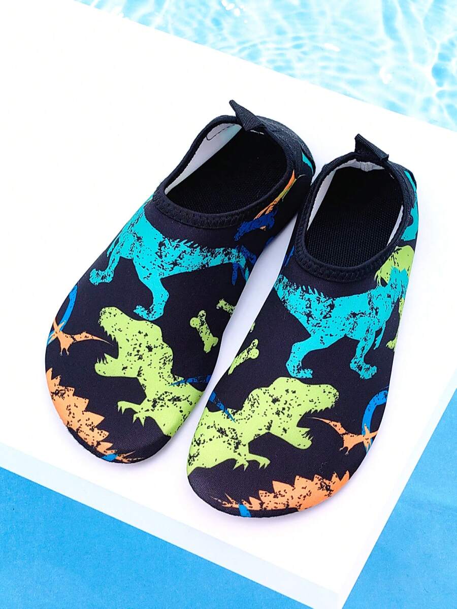 Black kids aqua socks featuring a flame dragon pattern with breathable fabric and flexible TPR soles for beach and swimming activities.