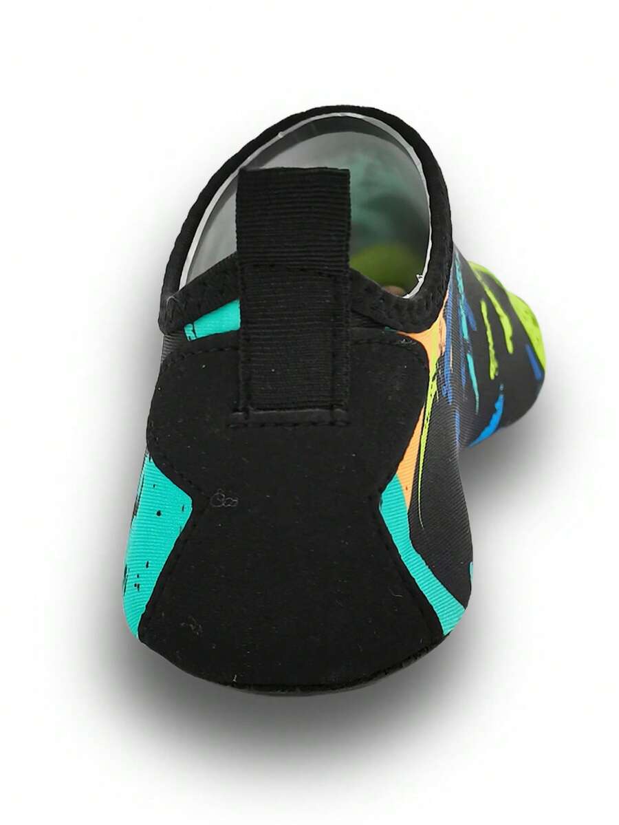 Black kids aqua socks featuring a flame dragon pattern with breathable fabric and flexible TPR soles for beach and swimming activities.