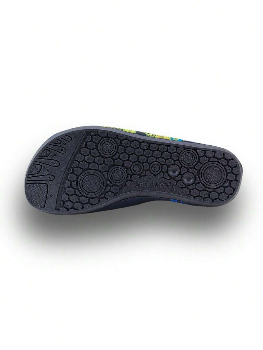 Black kids aqua socks featuring a flame dragon pattern with breathable fabric and flexible TPR soles for beach and swimming activities.