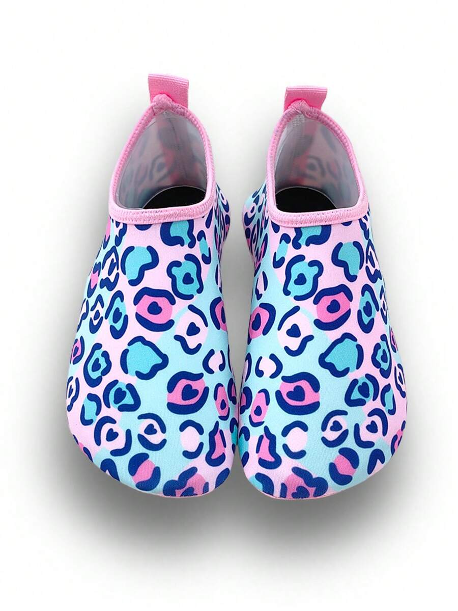 Girls pink slip-on aqua socks with breathable fabric upper and flexible TPR outsole for beach and water activities.