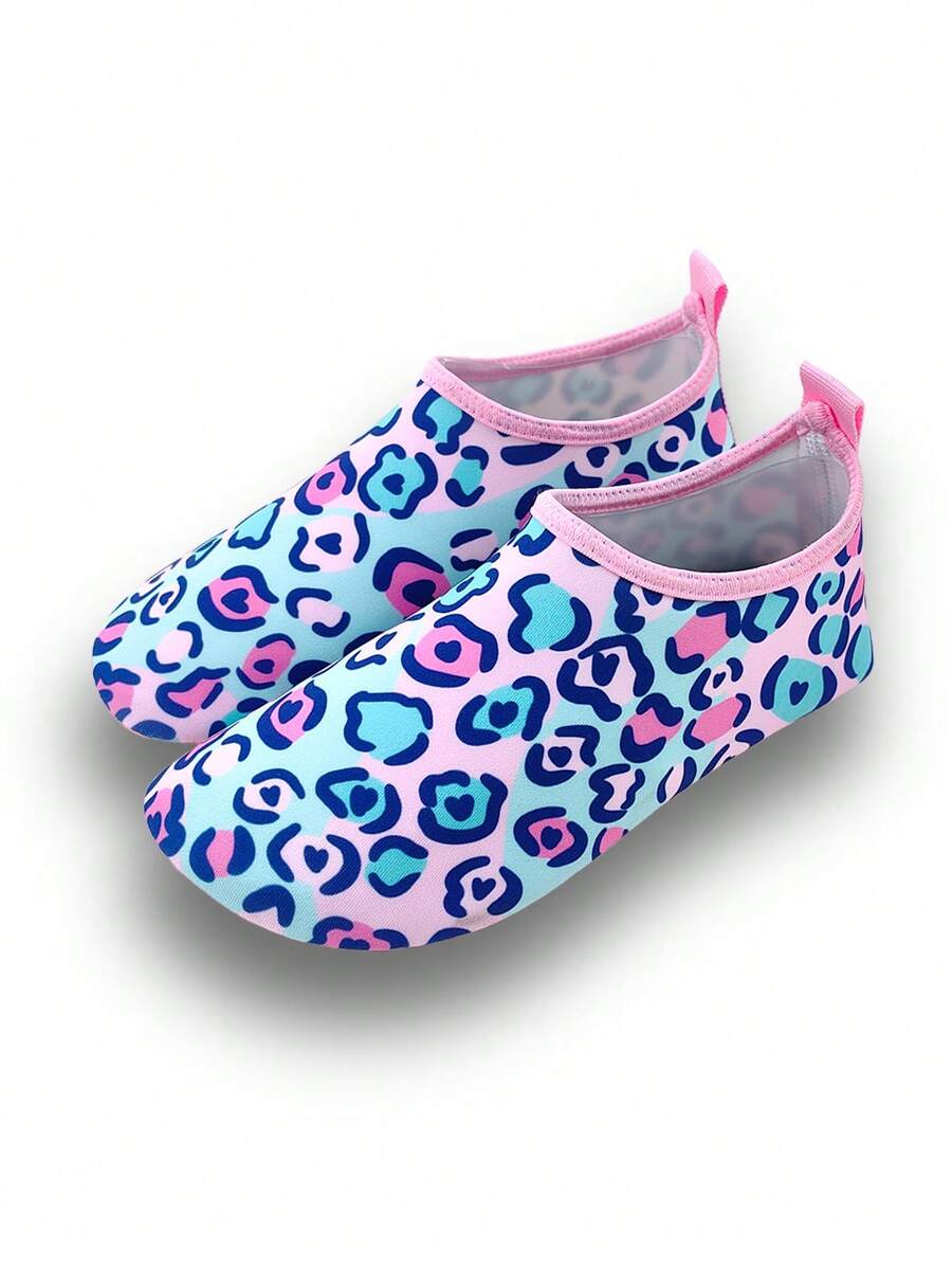 Girls pink slip-on aqua socks with breathable fabric upper and flexible TPR outsole for beach and water activities.