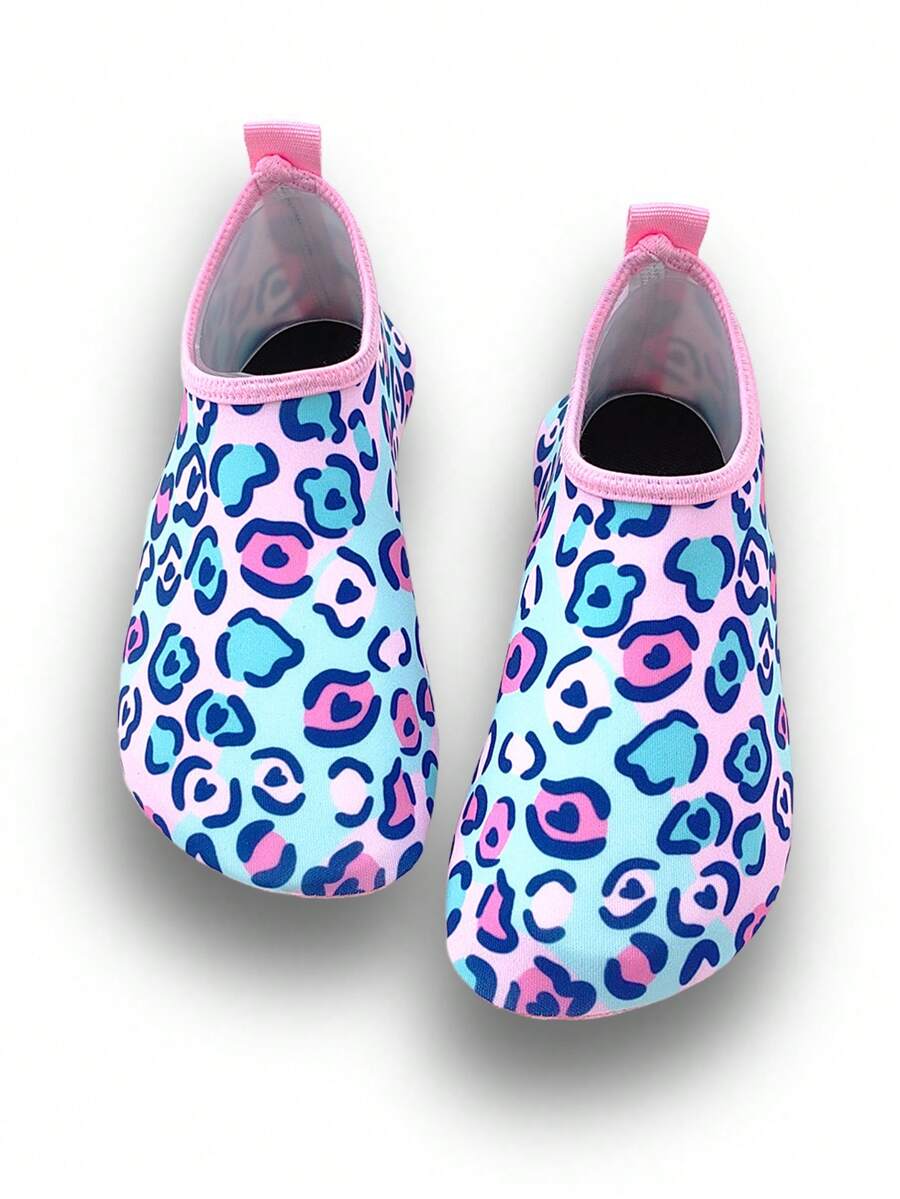 Girls pink slip-on aqua socks with breathable fabric upper and flexible TPR outsole for beach and water activities.