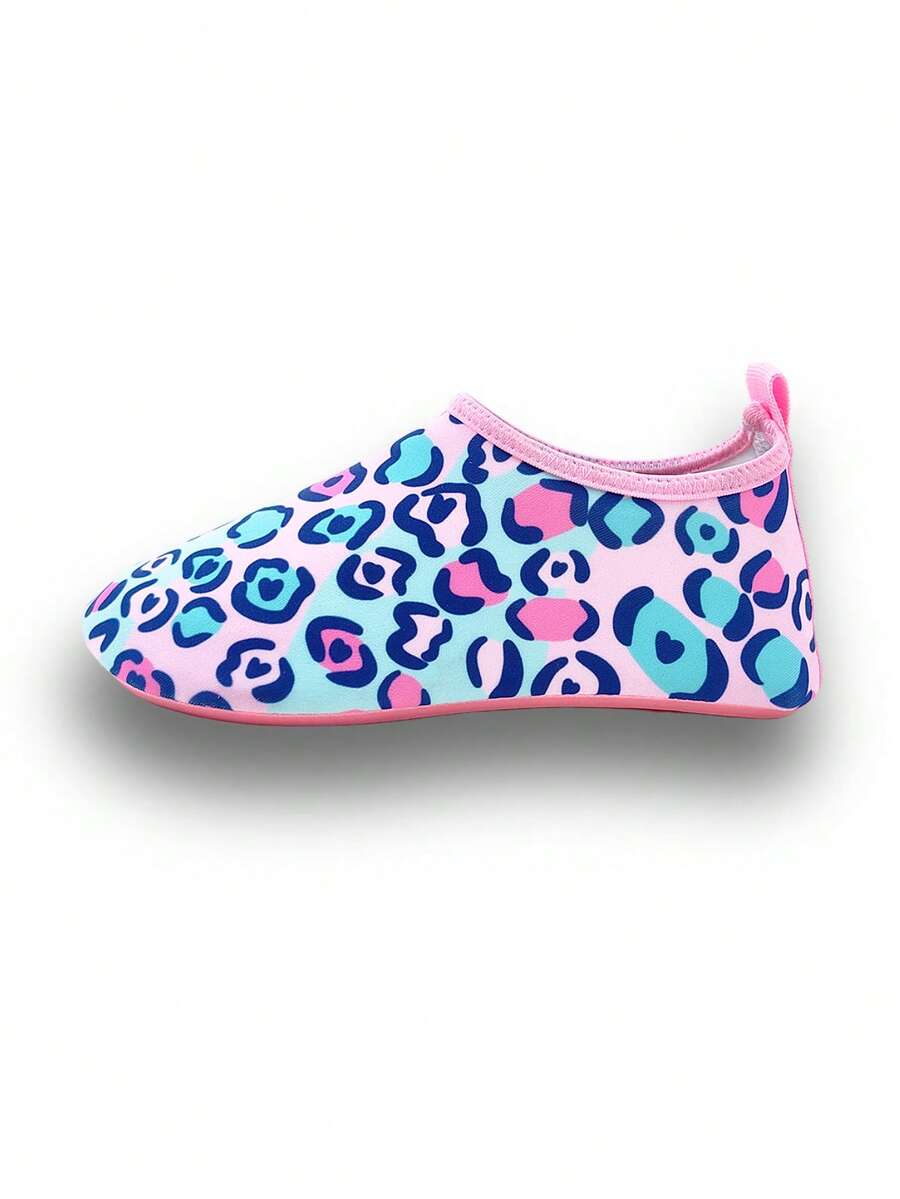 Girls pink slip-on aqua socks with breathable fabric upper and flexible TPR outsole for beach and water activities.