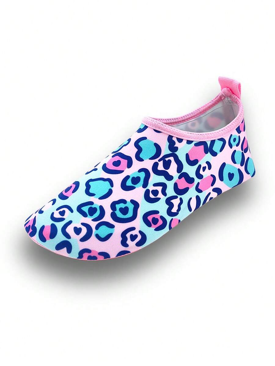 Girls pink slip-on aqua socks with breathable fabric upper and flexible TPR outsole for beach and water activities.