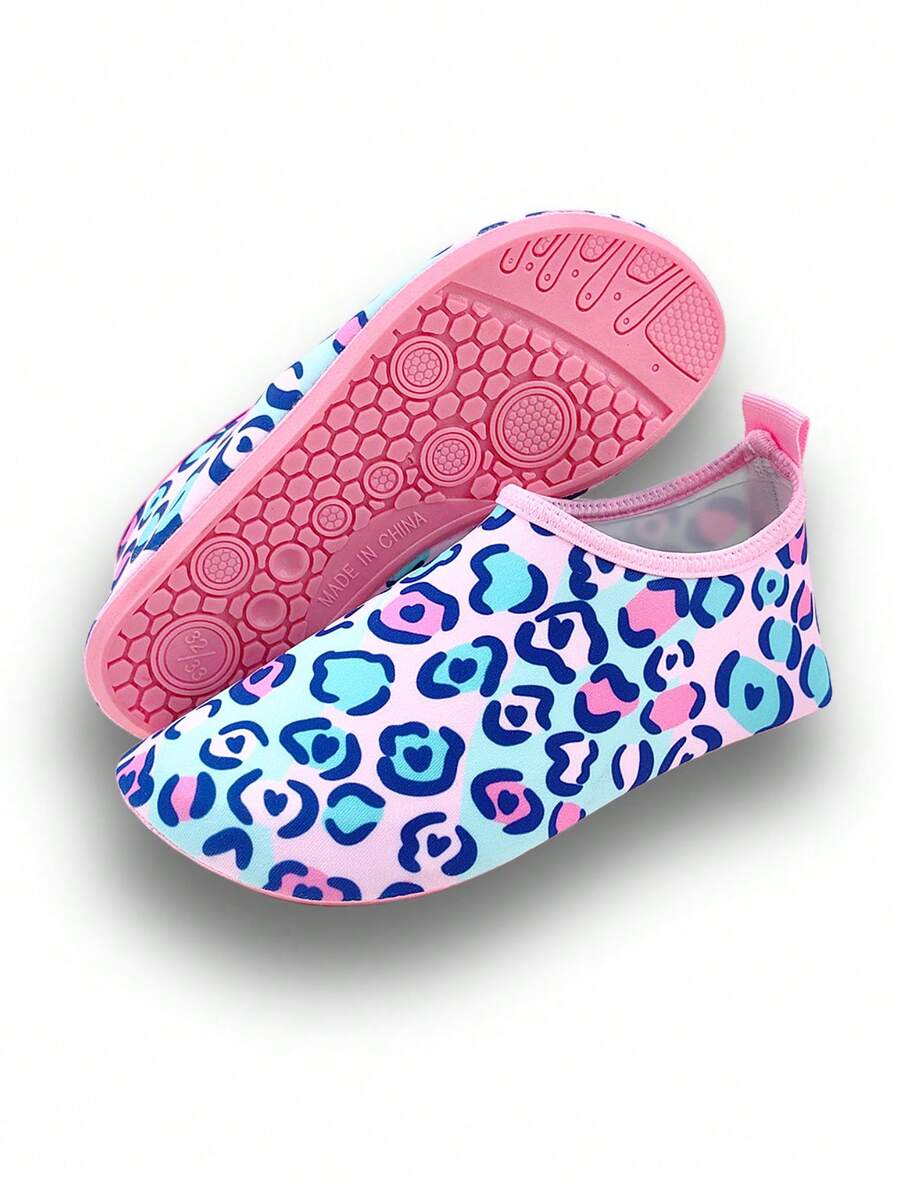 Girls pink slip-on aqua socks with breathable fabric upper and flexible TPR outsole for beach and water activities.