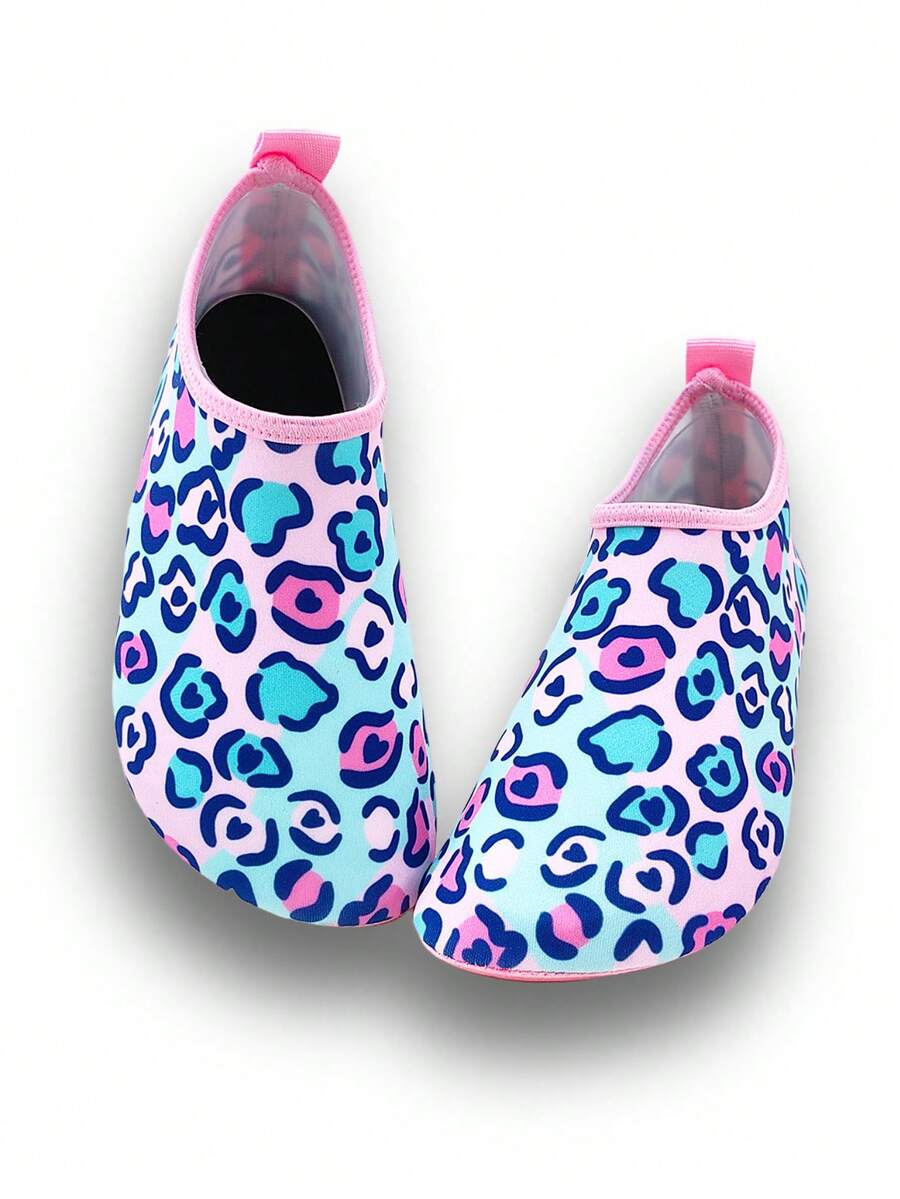 Girls pink slip-on aqua socks with breathable fabric upper and flexible TPR outsole for beach and water activities.