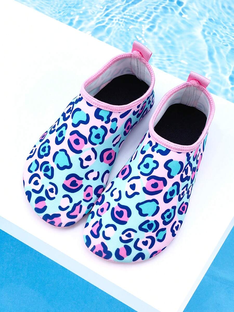 Girls pink slip-on aqua socks with breathable fabric upper and flexible TPR outsole for beach and water activities.