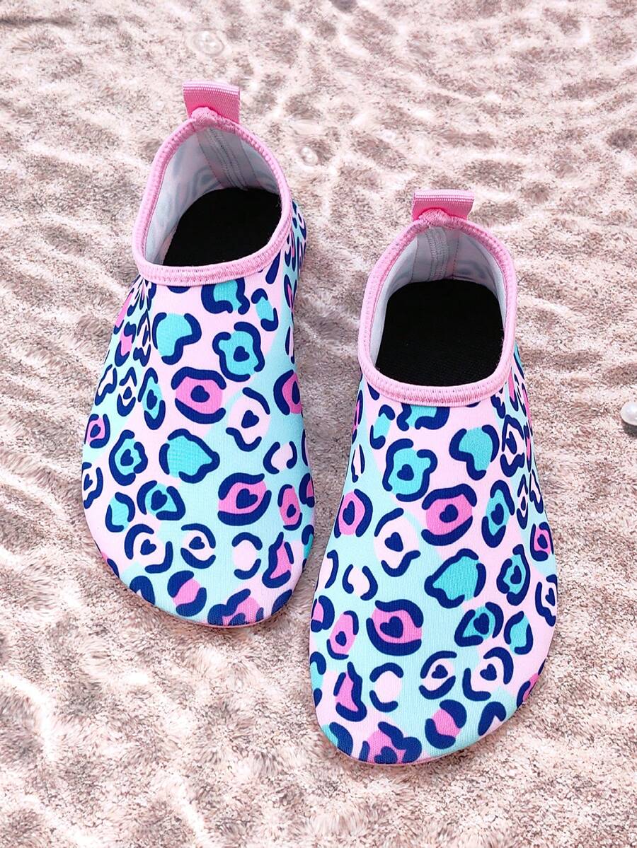 Girls pink slip-on aqua socks with breathable fabric upper and flexible TPR outsole for beach and water activities.