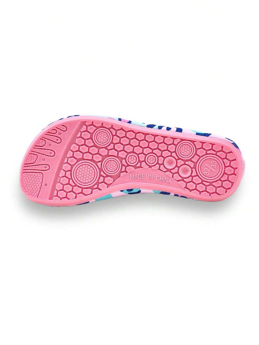 Girls pink slip-on aqua socks with breathable fabric upper and flexible TPR outsole for beach and water activities.