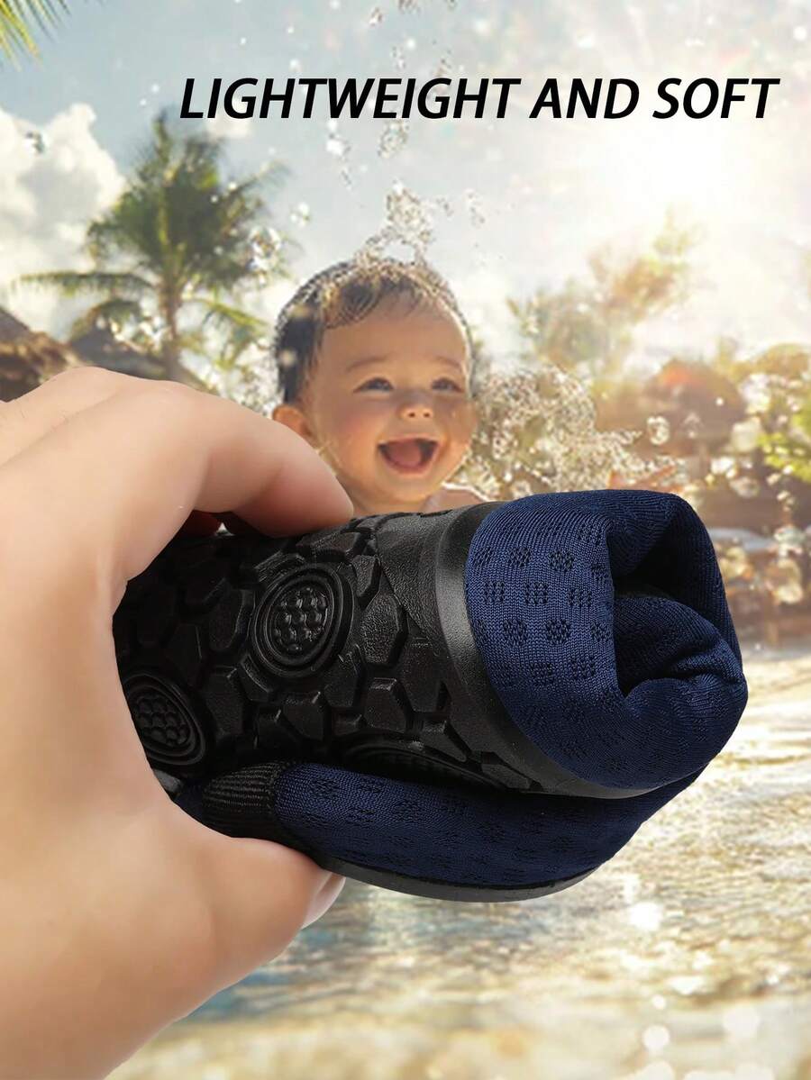 Black slip-on kids water shoes with a graphic pattern fabric upper and wear-resistant rubber outsole for boys and girls.