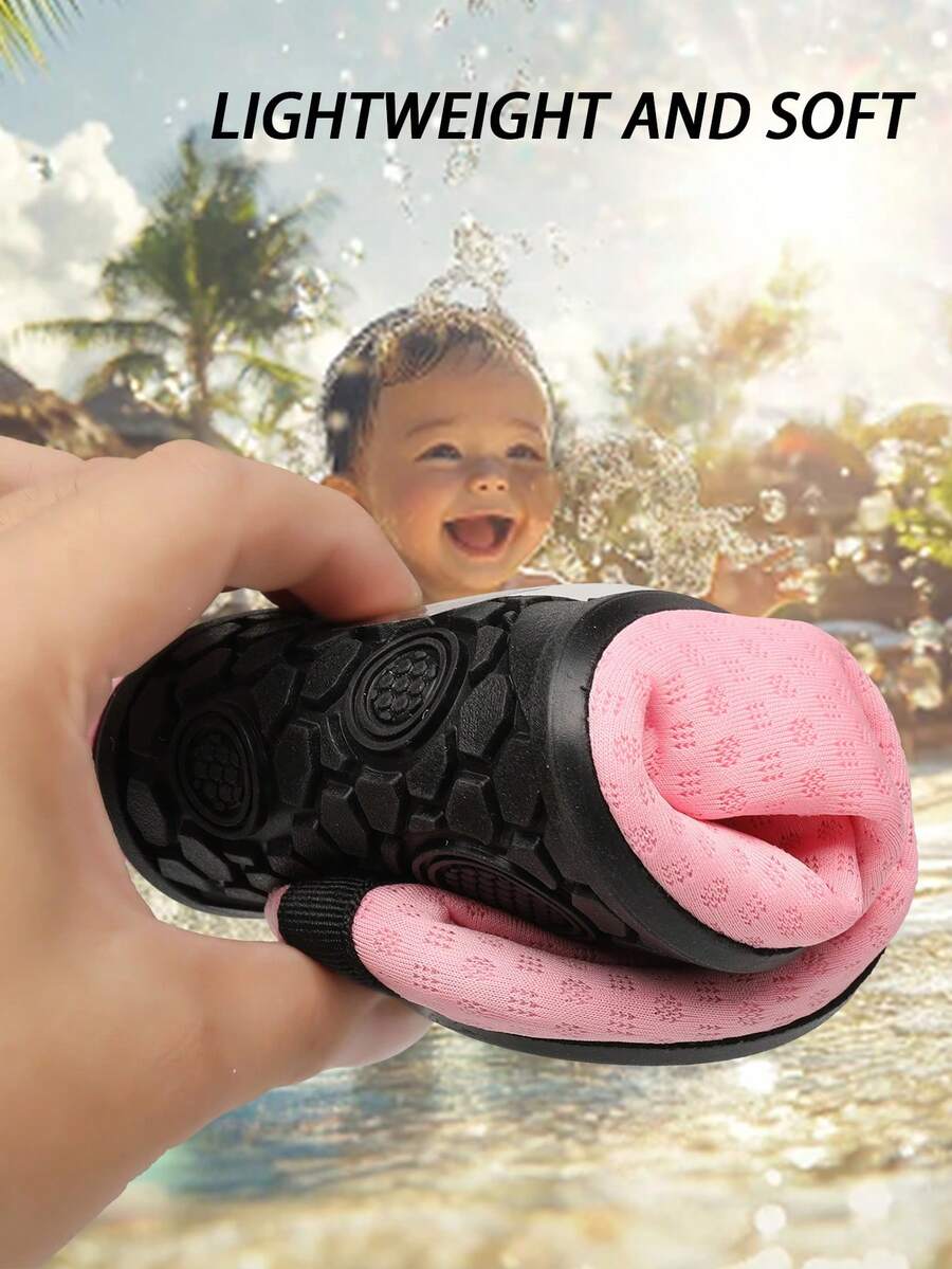 Black slip-on kids water shoes with a graphic pattern fabric upper and wear-resistant rubber outsole for boys and girls.
