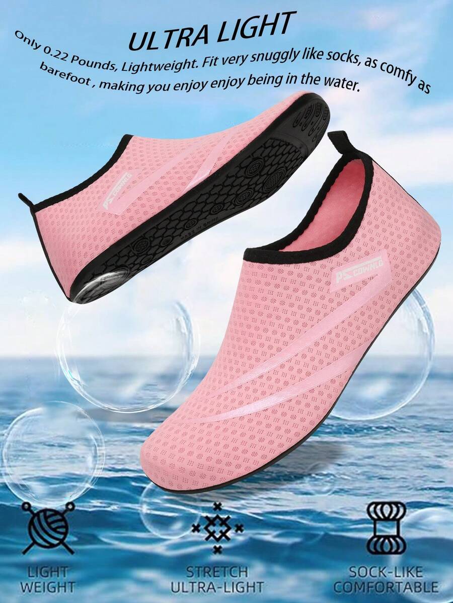 Black slip-on kids water shoes with a graphic pattern fabric upper and wear-resistant rubber outsole for boys and girls.