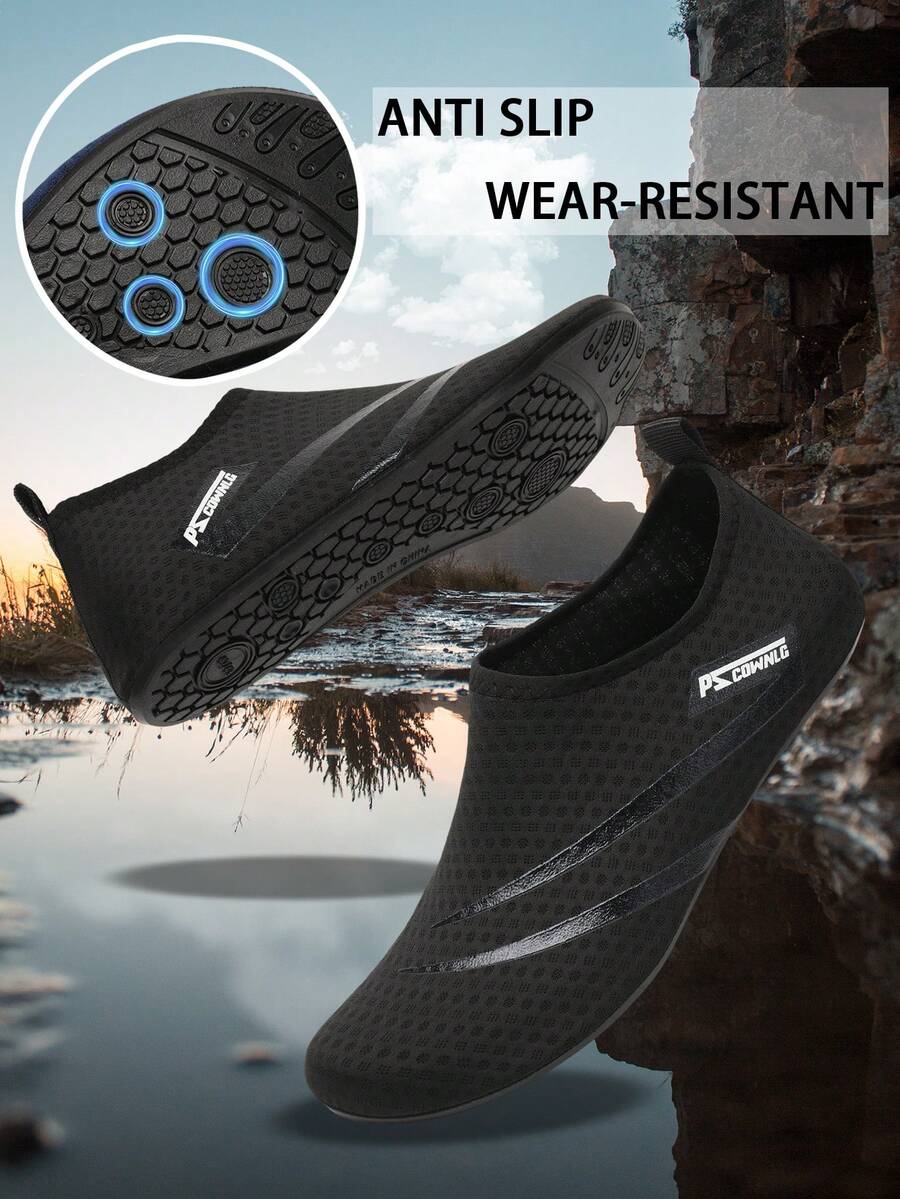 Black slip-on kids water shoes with a graphic pattern fabric upper and wear-resistant rubber outsole for boys and girls.