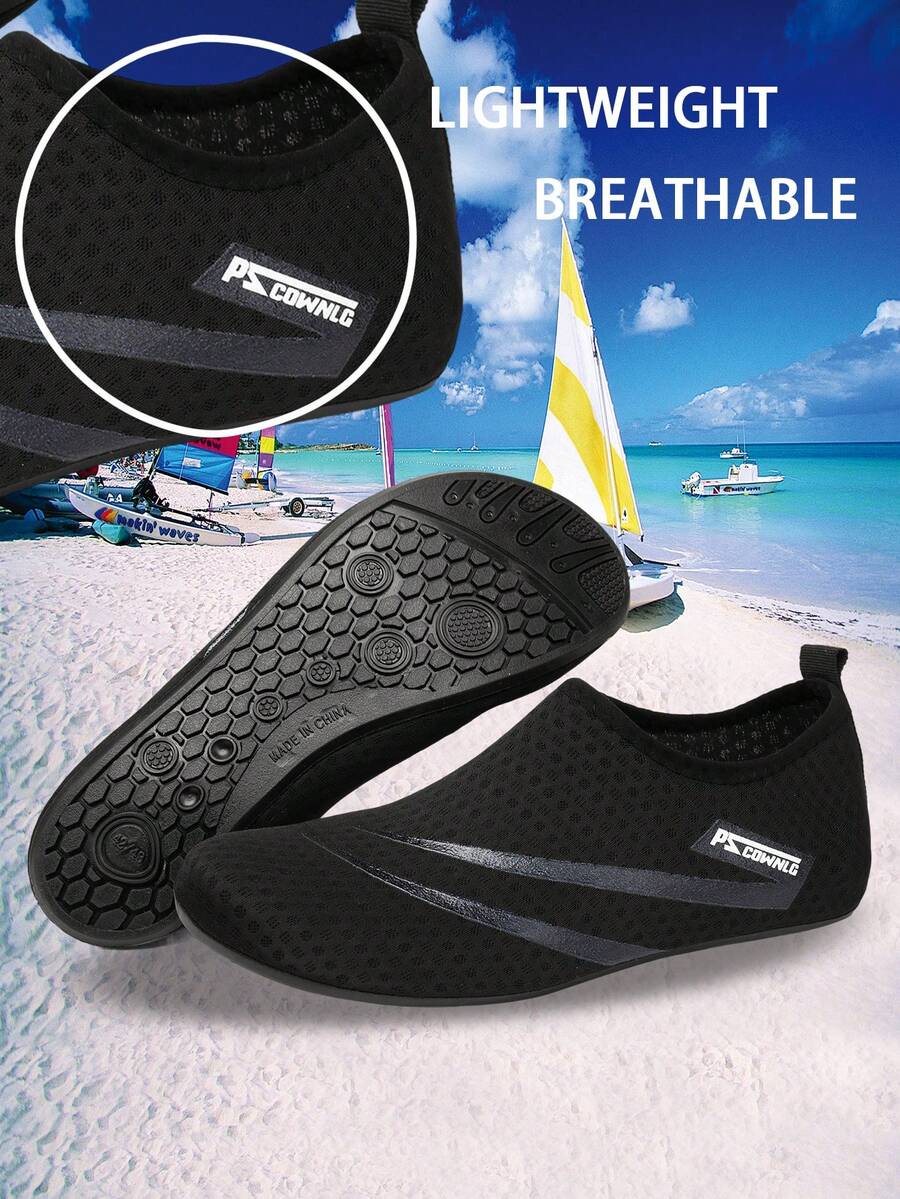 Black slip-on kids water shoes with a graphic pattern fabric upper and wear-resistant rubber outsole for boys and girls.