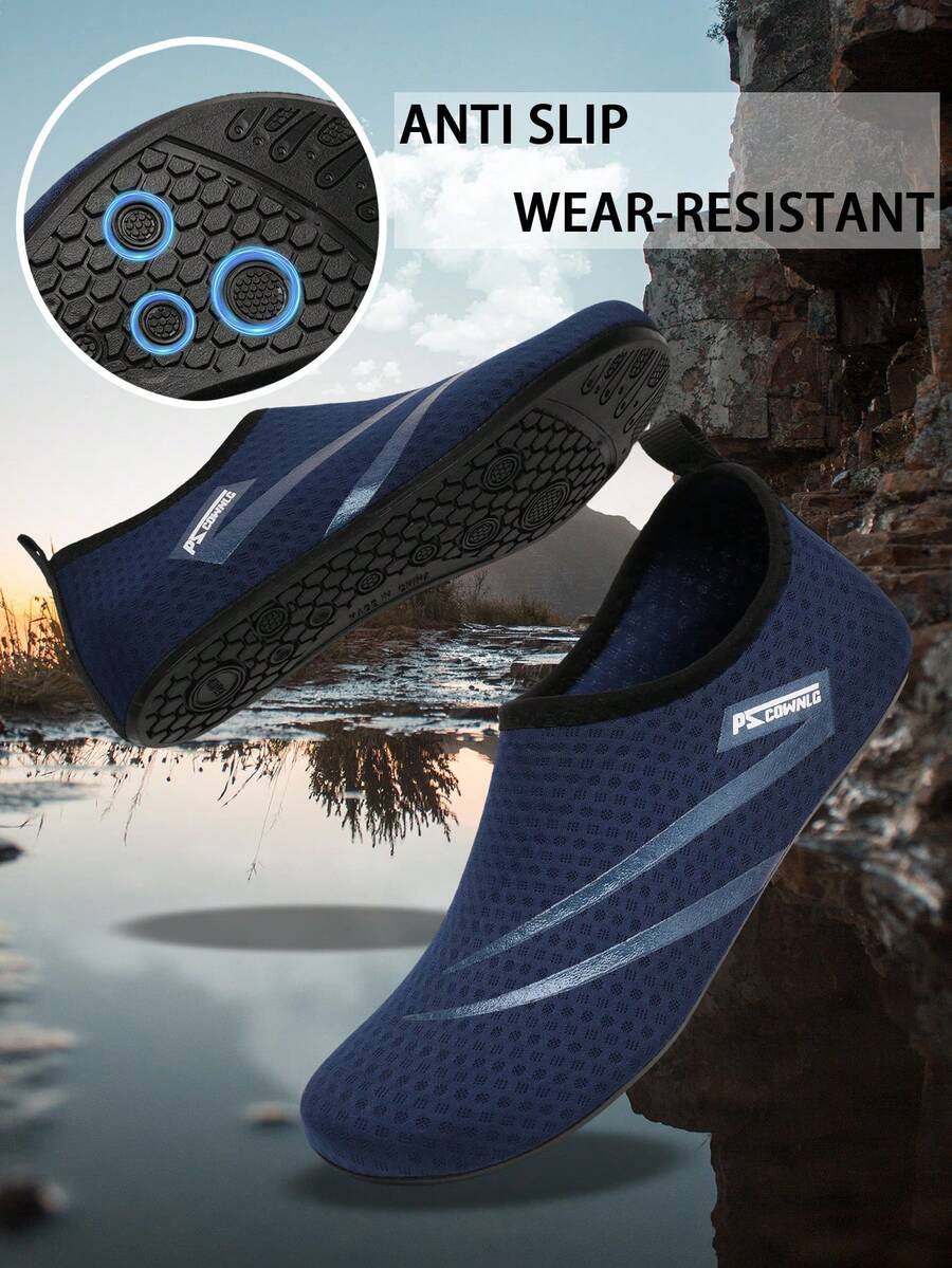 Black slip-on kids water shoes with a graphic pattern fabric upper and wear-resistant rubber outsole for boys and girls.