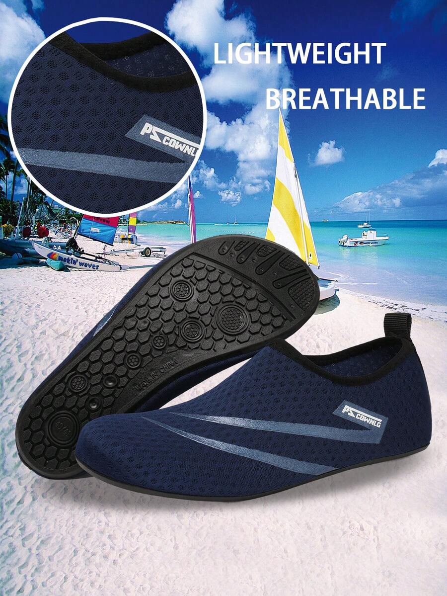 Black slip-on kids water shoes with a graphic pattern fabric upper and wear-resistant rubber outsole for boys and girls.