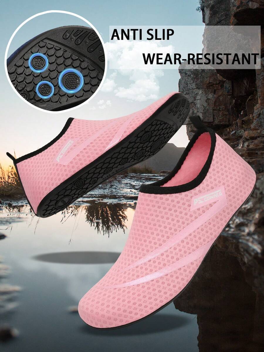 Black slip-on kids water shoes with a graphic pattern fabric upper and wear-resistant rubber outsole for boys and girls.