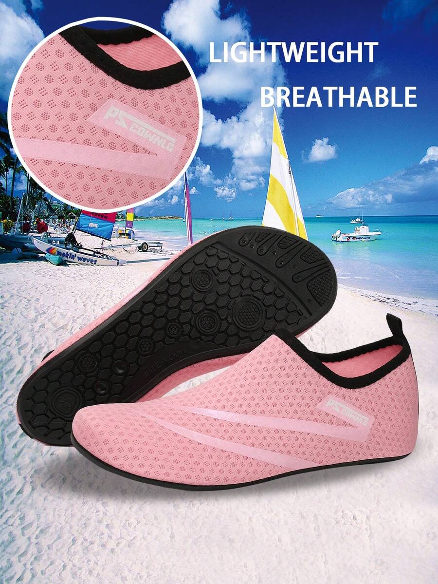 Black slip-on kids water shoes with a graphic pattern fabric upper and wear-resistant rubber outsole for boys and girls.