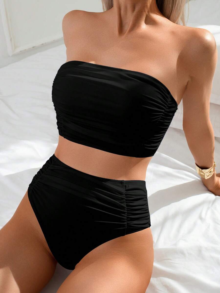 Women's black strapless ruched bandeau bikini top with high waisted bottoms