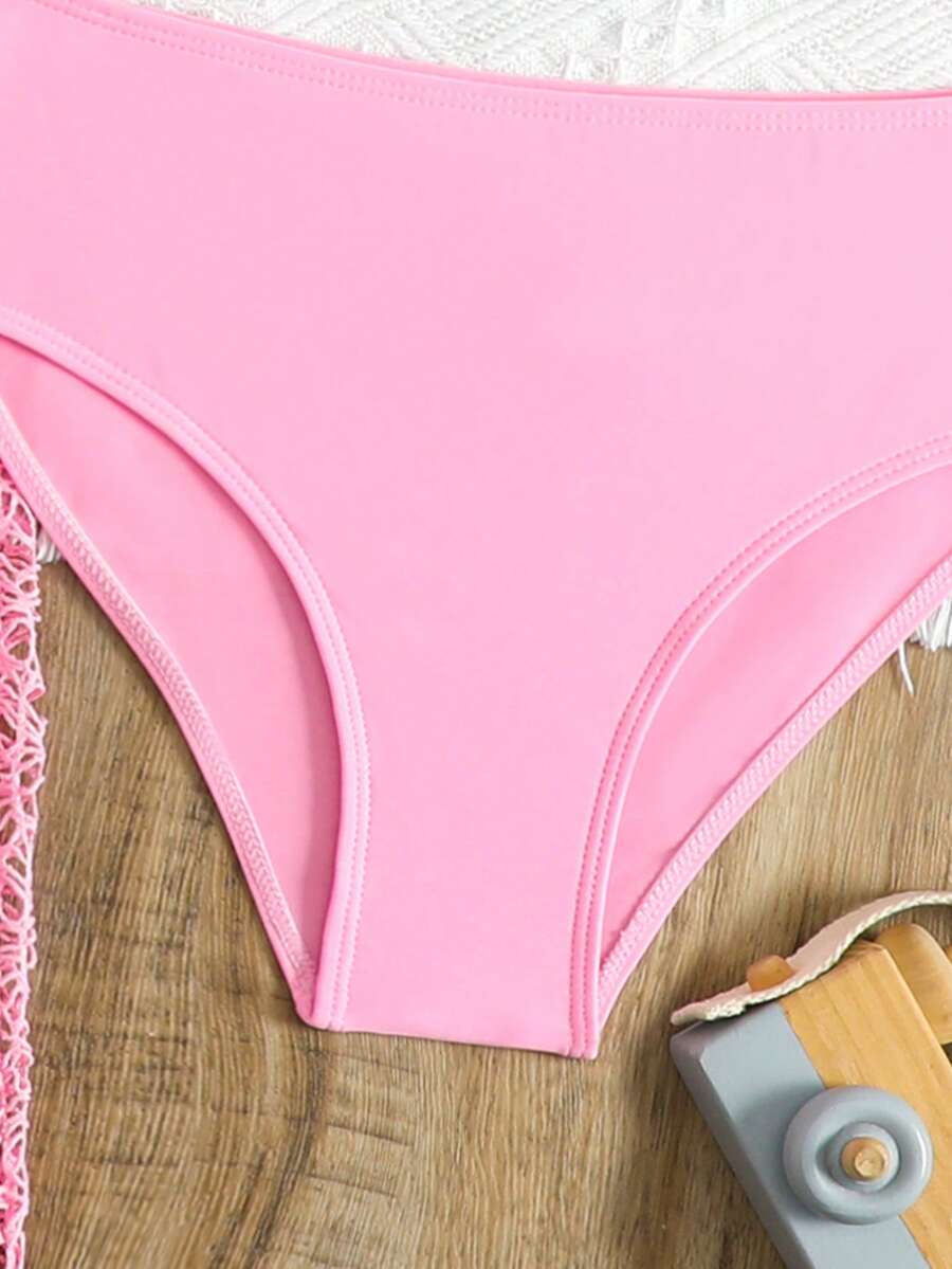 Tween girls beige bikini set with long sleeve round neck top, hollow-out asymmetrical details, mid-waist bottoms, and cover up for beach or vacation swimwear