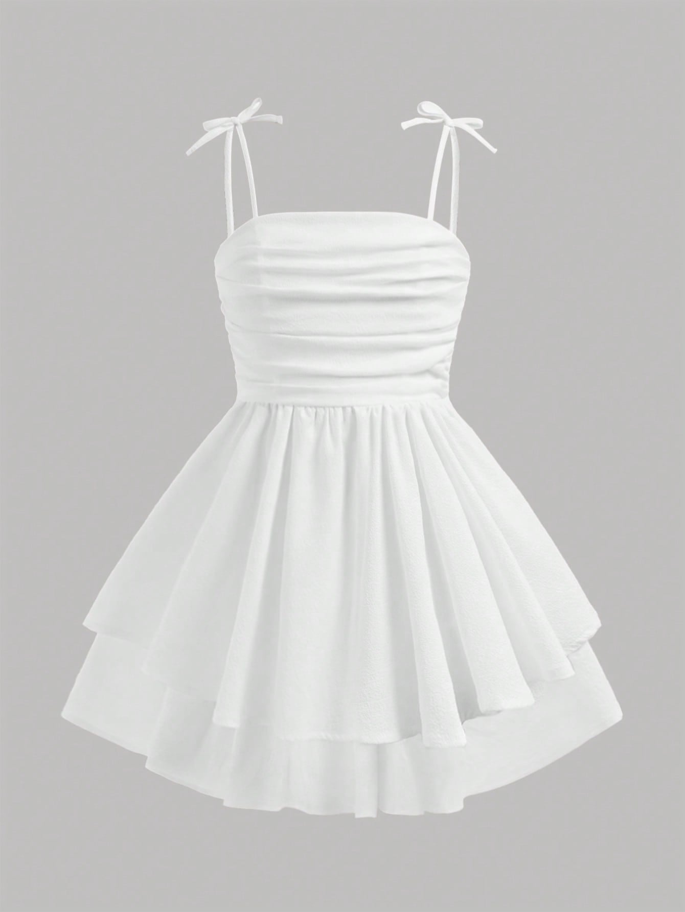 Tween girls apricot tiered cami dress with spaghetti straps, high waist, and slim fit layered hem.