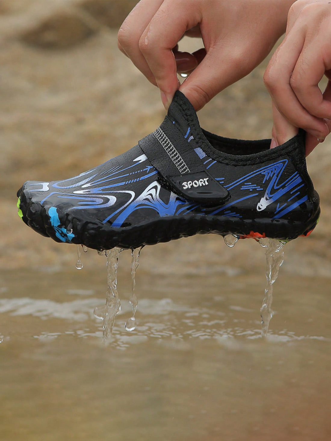 Children's water shoes featuring a breathable mesh upper, hook and loop closure, luminous details, and a non-slip outsole for boys and girls.