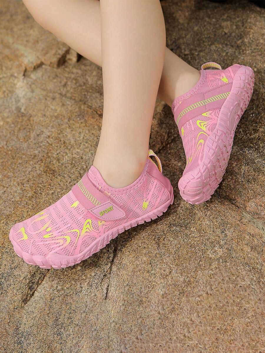 Children's water shoes featuring a breathable mesh upper, hook and loop closure, luminous details, and a non-slip outsole for boys and girls.