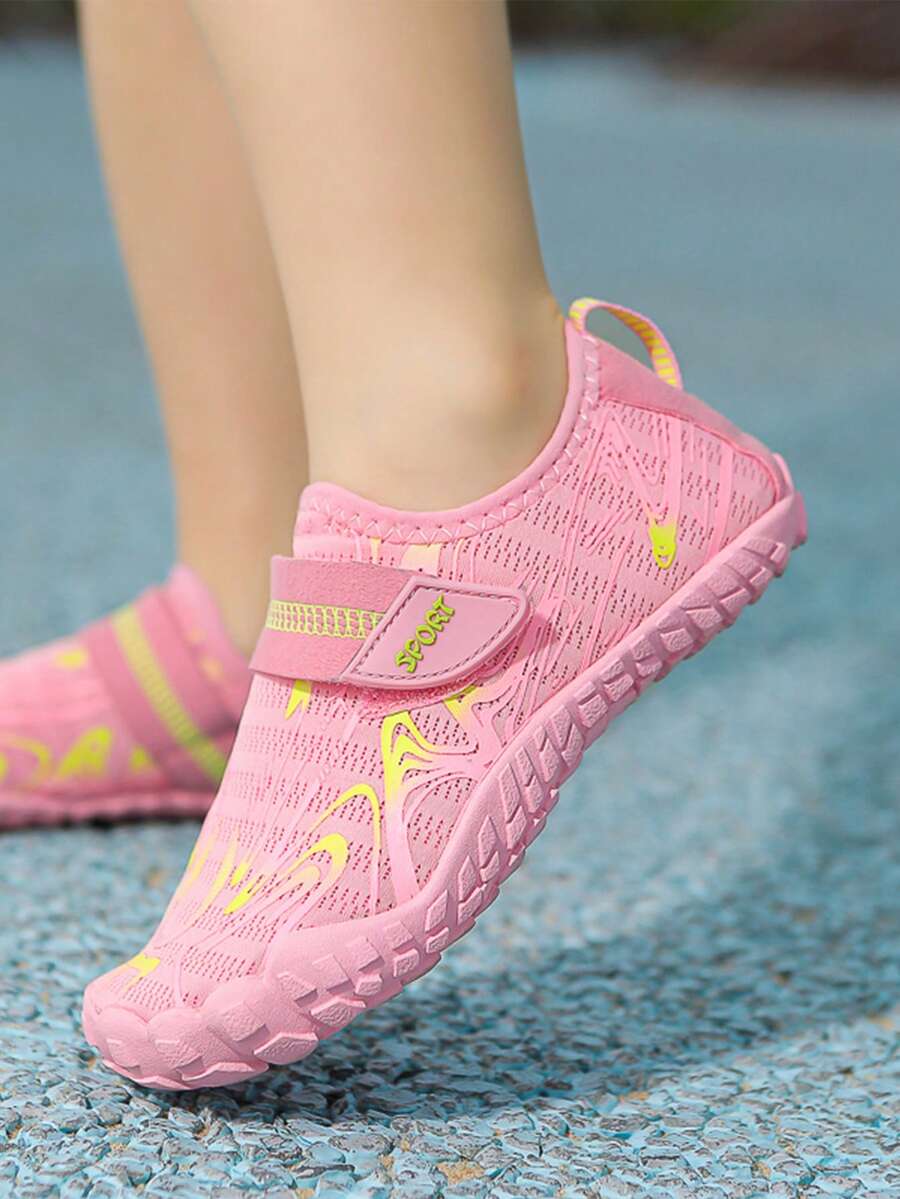 Children's water shoes featuring a breathable mesh upper, hook and loop closure, luminous details, and a non-slip outsole for boys and girls.