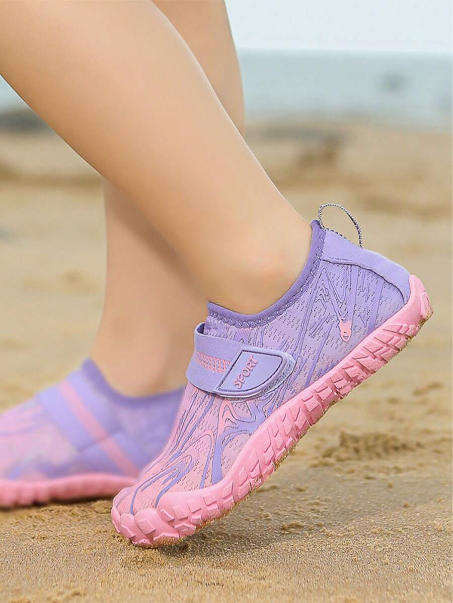 Children's water shoes featuring a breathable mesh upper, hook and loop closure, luminous details, and a non-slip outsole for boys and girls.