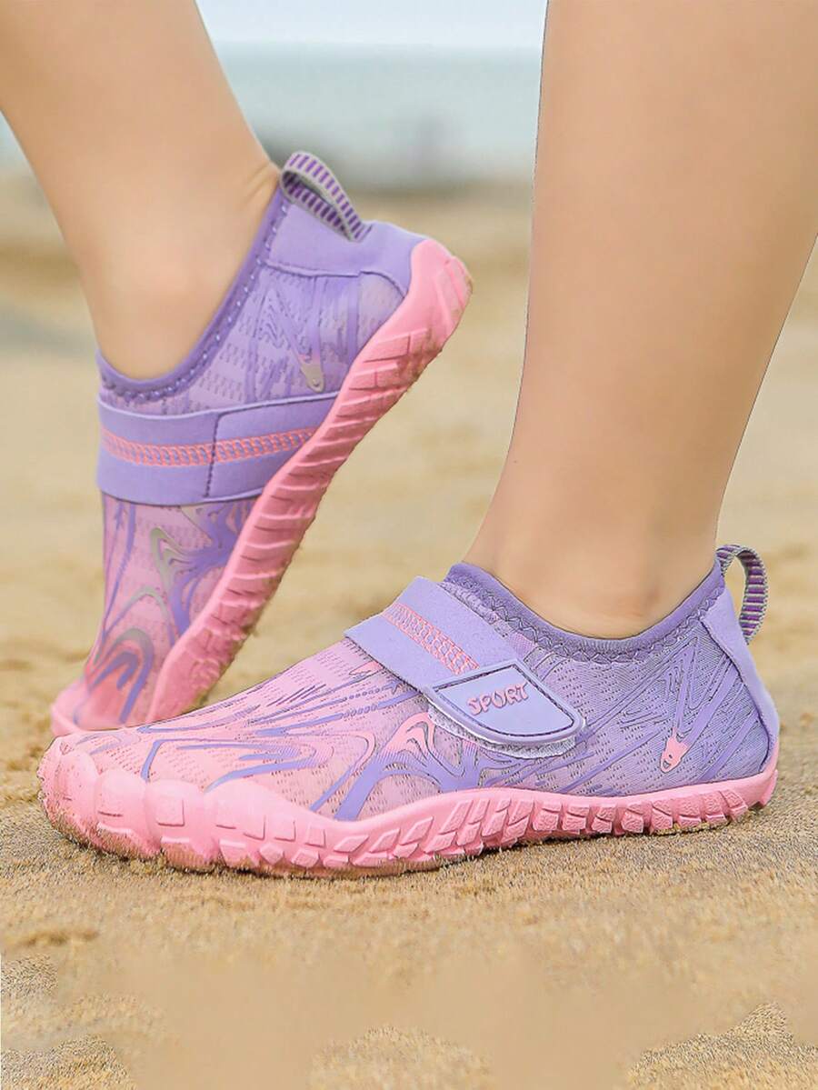 Children's water shoes featuring a breathable mesh upper, hook and loop closure, luminous details, and a non-slip outsole for boys and girls.