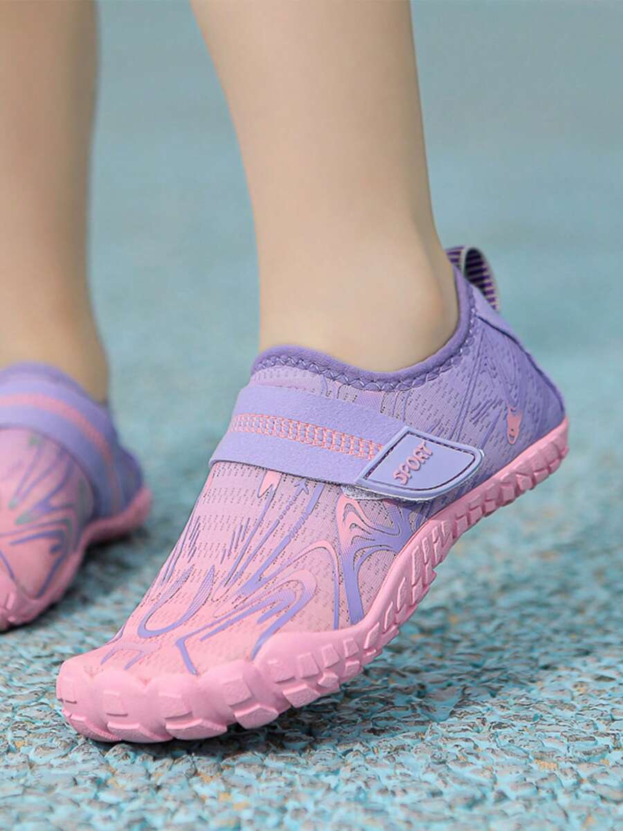 Children's water shoes featuring a breathable mesh upper, hook and loop closure, luminous details, and a non-slip outsole for boys and girls.