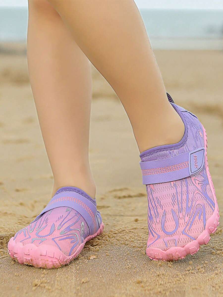 Children's water shoes featuring a breathable mesh upper, hook and loop closure, luminous details, and a non-slip outsole for boys and girls.