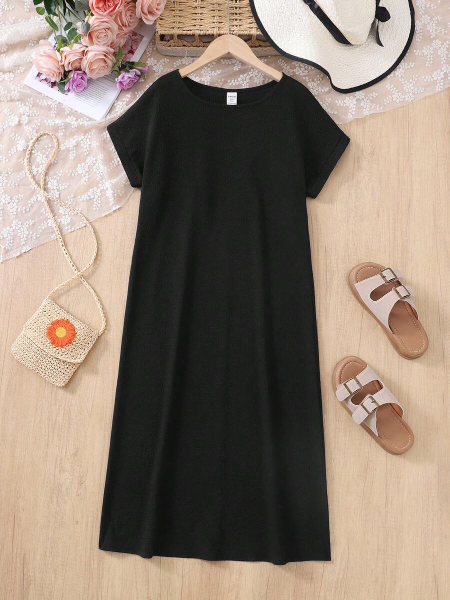 Tween girls casual black A-line long dress featuring short sleeves, a round neckline, and a decorative front bow with contrast lace trim.