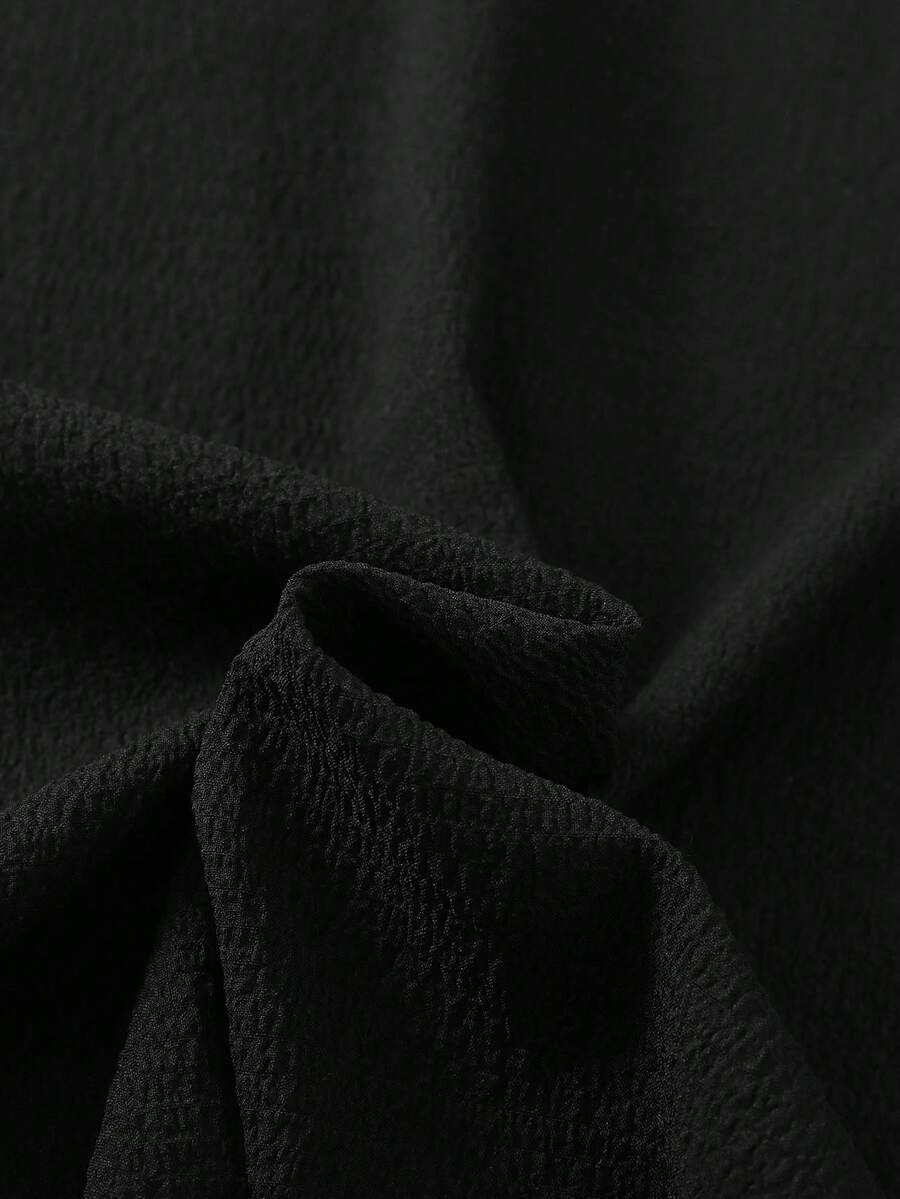 Tween girls casual black A-line long dress featuring short sleeves, a round neckline, and a decorative front bow with contrast lace trim.