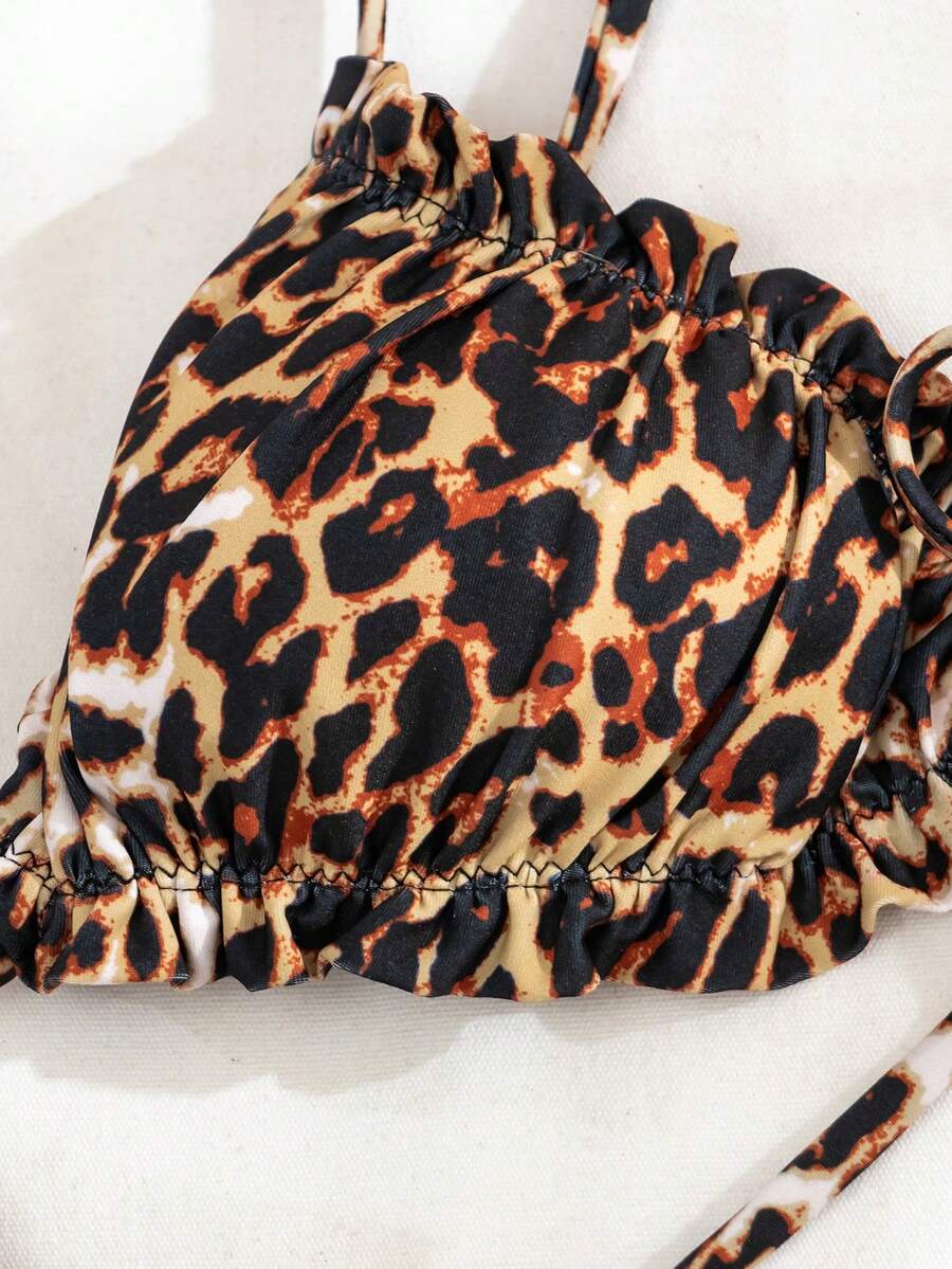 Multicolor leopard print two-piece bikini set featuring a frill trim triangle bra top and high waist tie side thong bottoms.