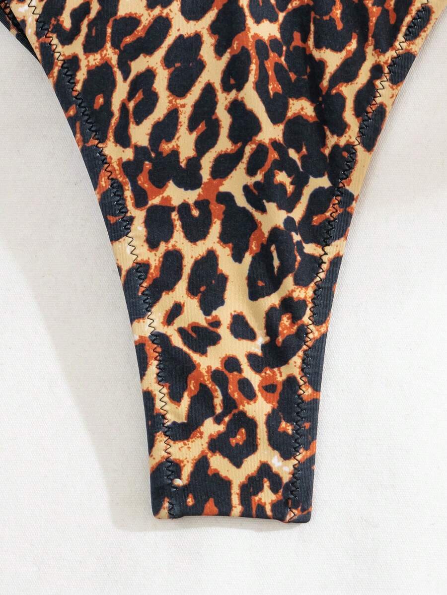 Multicolor leopard print two-piece bikini set featuring a frill trim triangle bra top and high waist tie side thong bottoms.