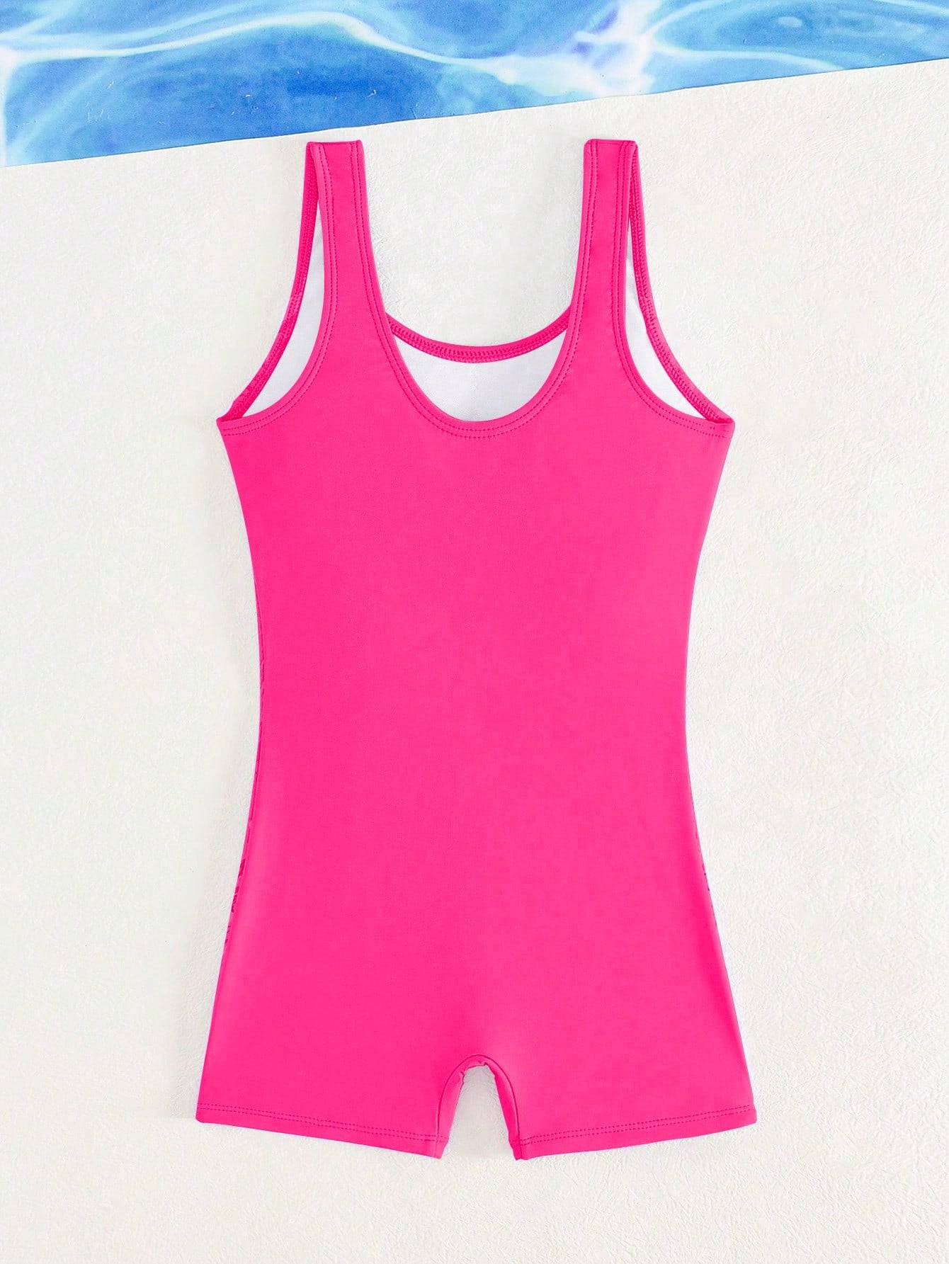 Tween girls colorblock camisole romper swimsuit with spaghetti straps, appliques, all-over print, fitted short silhouette, and medium-stretch fabric for beach, pool, and vacation wear.