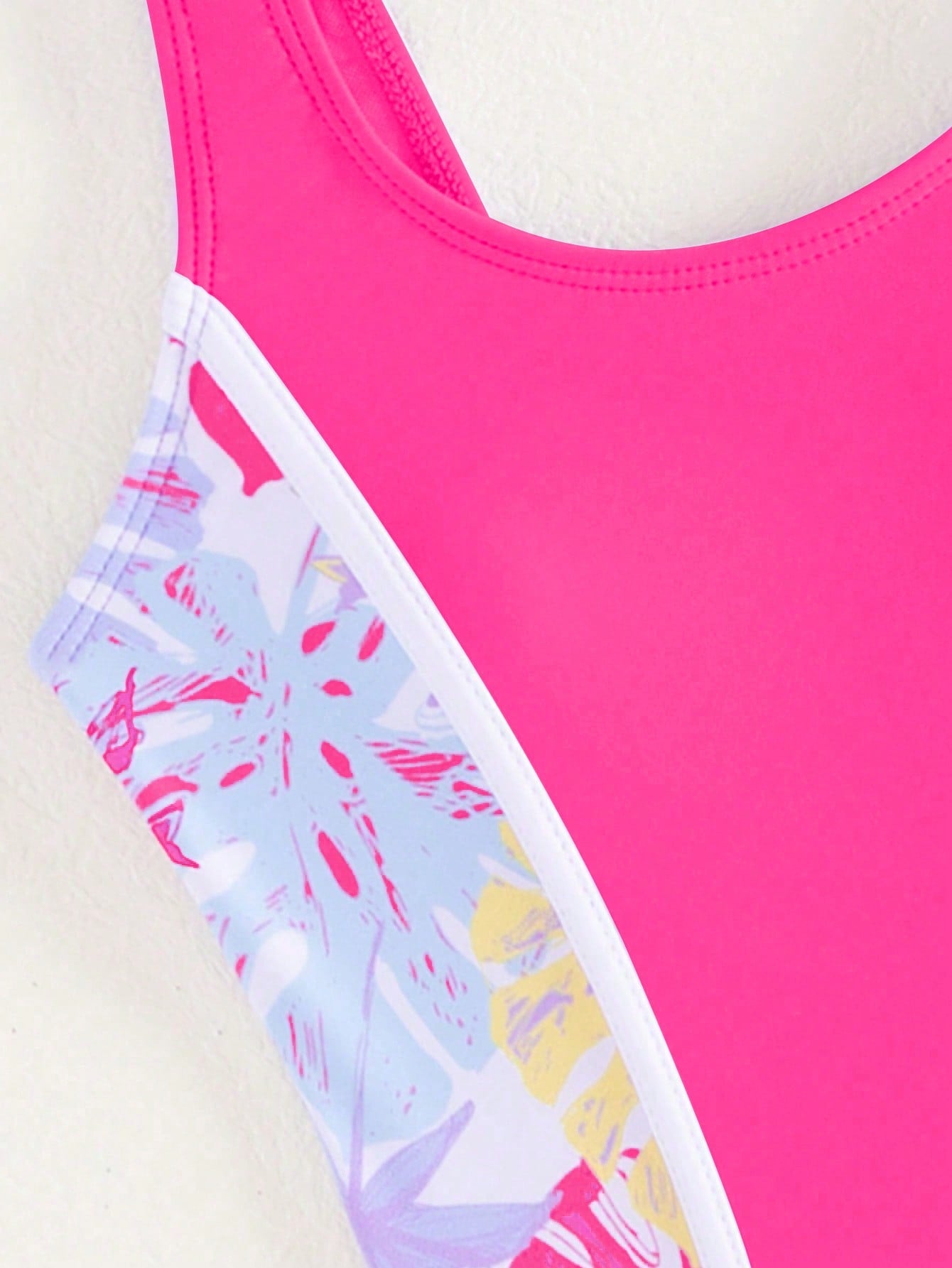 Tween girls colorblock camisole romper swimsuit with spaghetti straps, appliques, all-over print, fitted short silhouette, and medium-stretch fabric for beach, pool, and vacation wear.