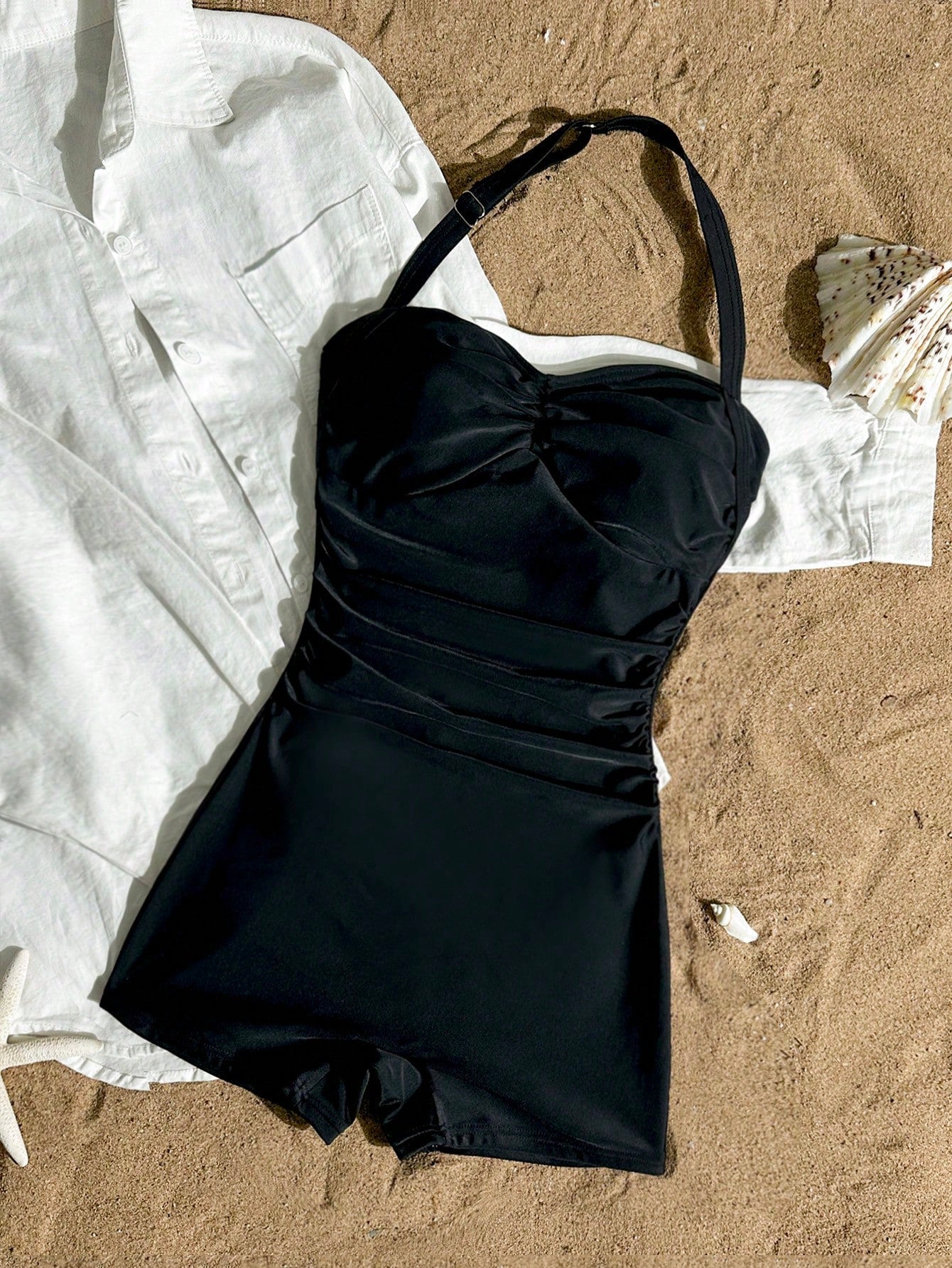 Apricot one-piece swimsuit for tween girls with a halter neckline, ruffle trim, textured knit fabric, fitted shape, and starfish metal decor.