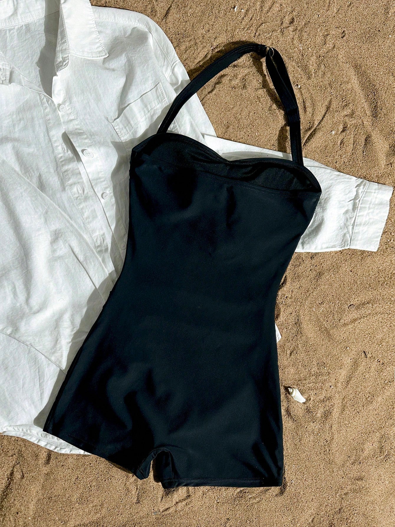 Apricot one-piece swimsuit for tween girls with a halter neckline, ruffle trim, textured knit fabric, fitted shape, and starfish metal decor.