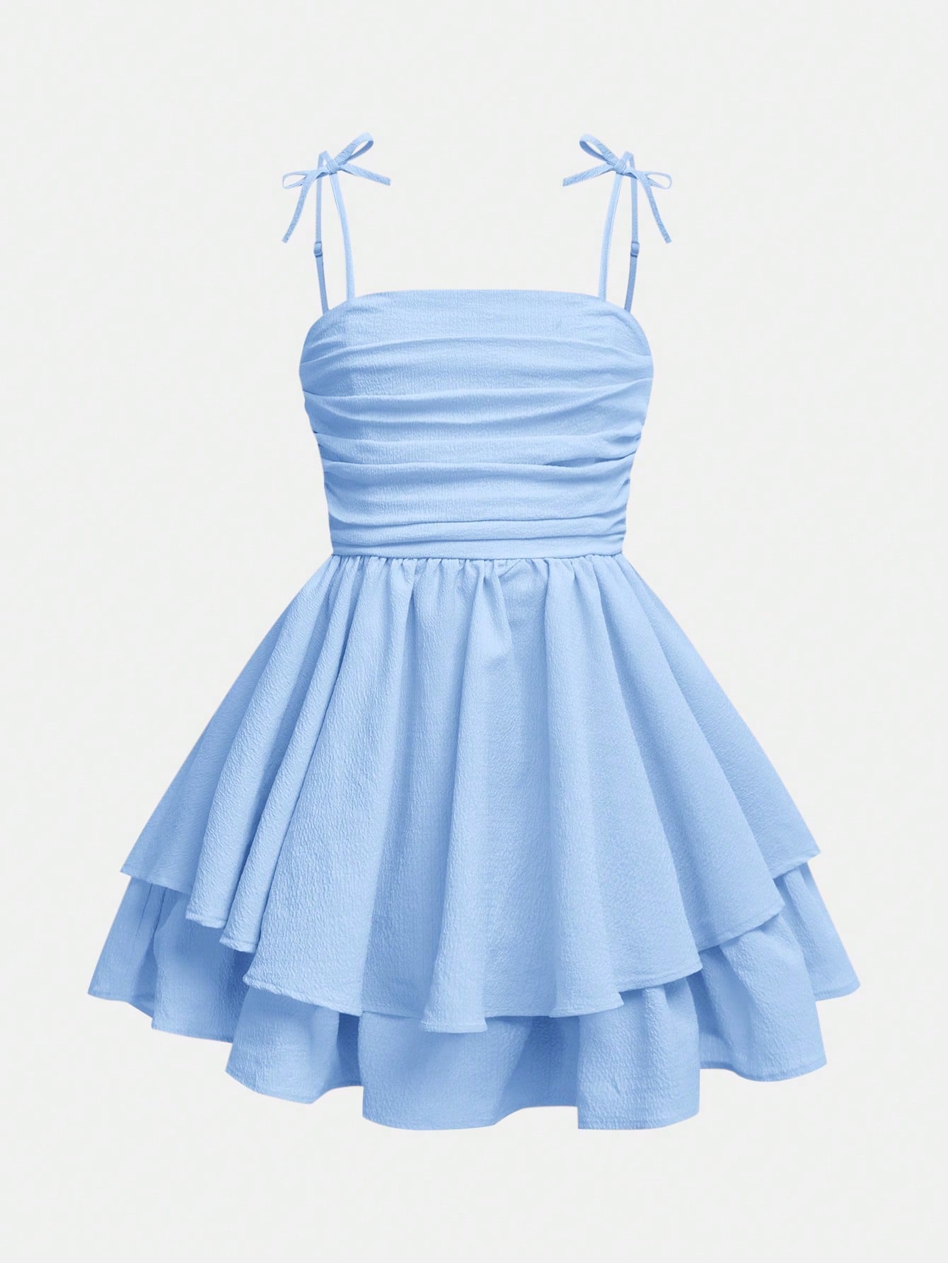 Tween girls apricot tiered cami dress with spaghetti straps, high waist, and slim fit layered hem.