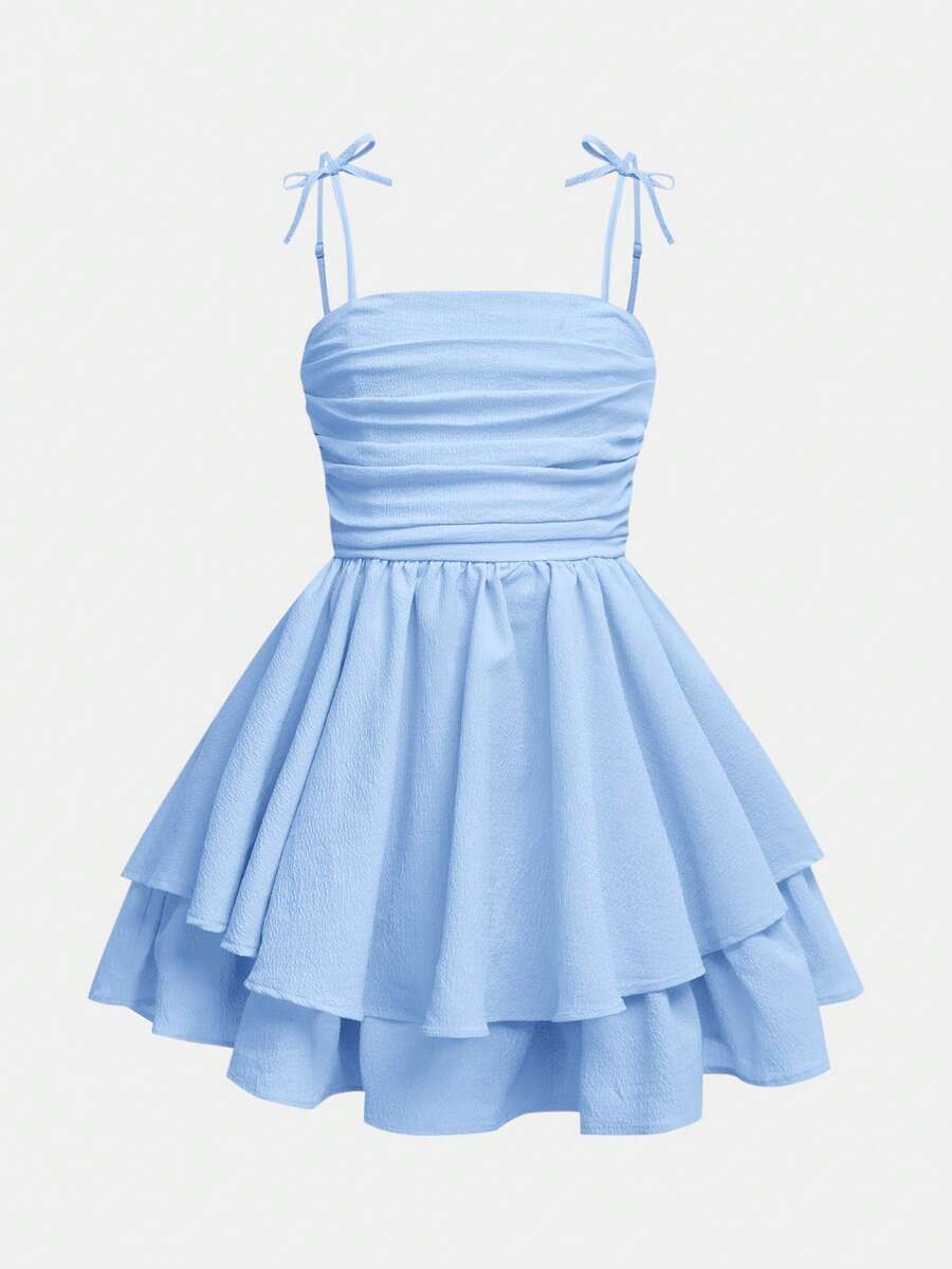 Tween girls apricot tiered cami dress with spaghetti straps, high waist, and slim fit layered hem.