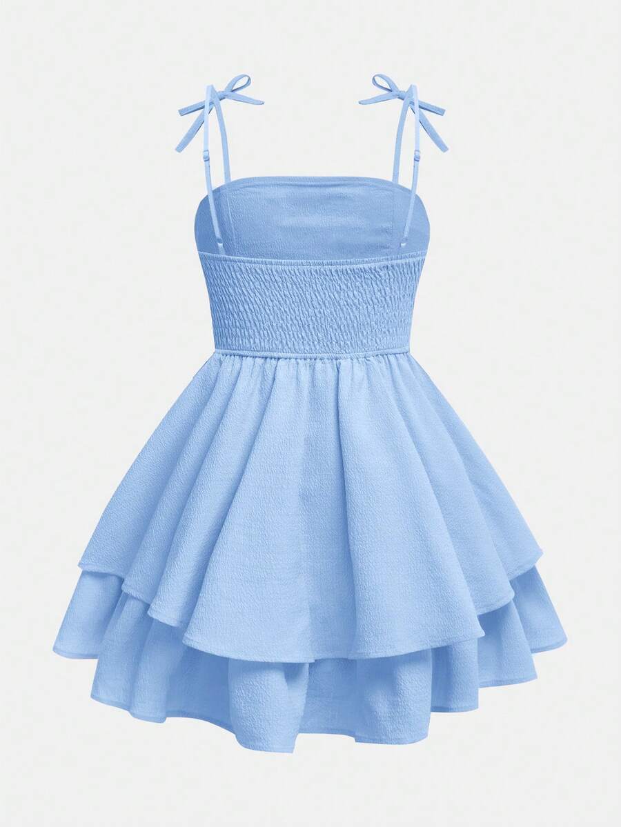 Tween girls apricot tiered cami dress with spaghetti straps, high waist, and slim fit layered hem.