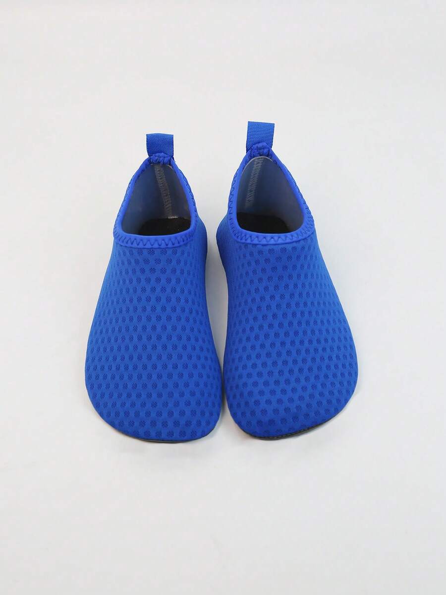 Kids slip-on aqua socks featuring geometric pattern, breathable Lycra upper, and non-slip TPR outsole for beach and water activities.