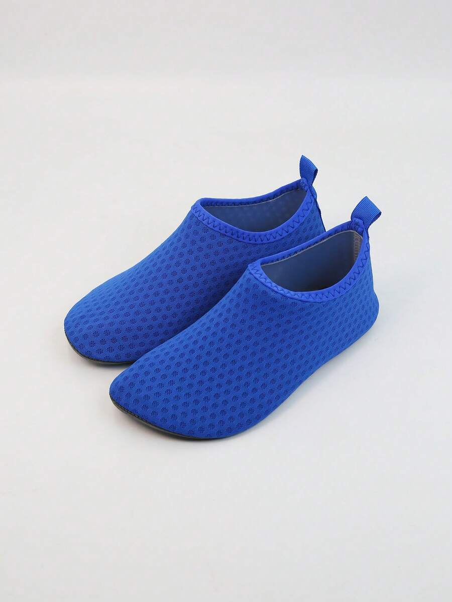 Kids slip-on aqua socks featuring geometric pattern, breathable Lycra upper, and non-slip TPR outsole for beach and water activities.