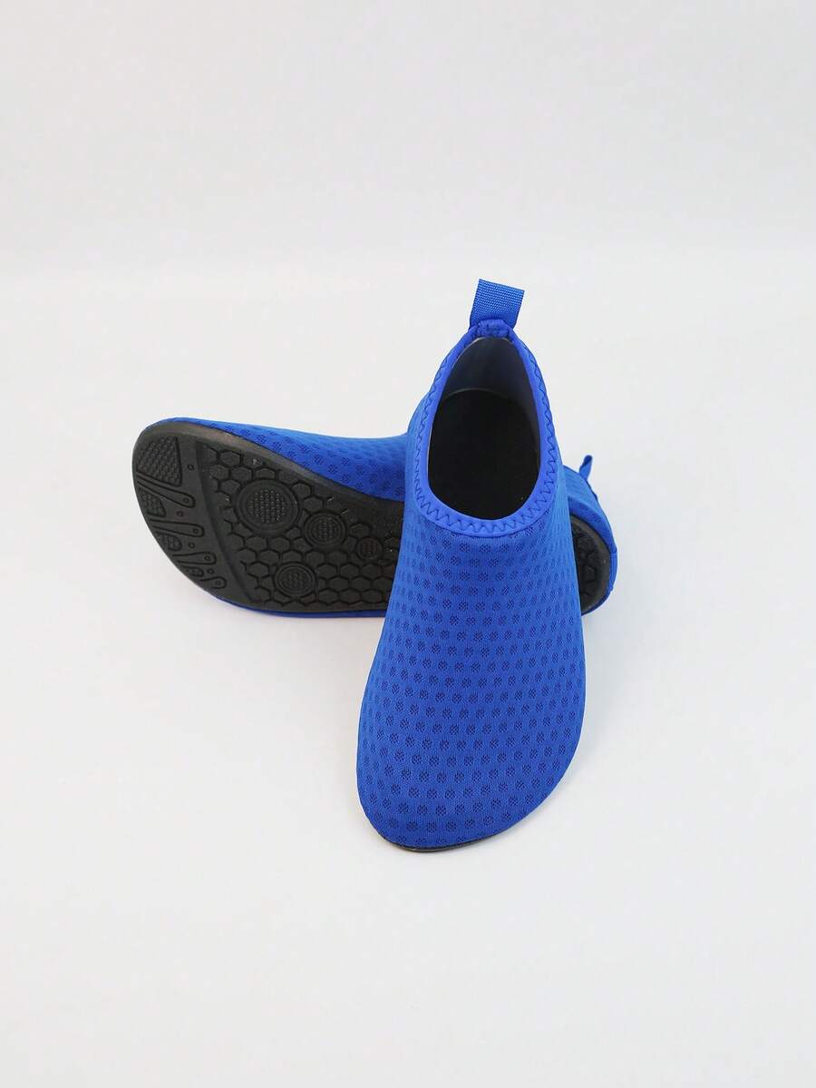 Kids slip-on aqua socks featuring geometric pattern, breathable Lycra upper, and non-slip TPR outsole for beach and water activities.