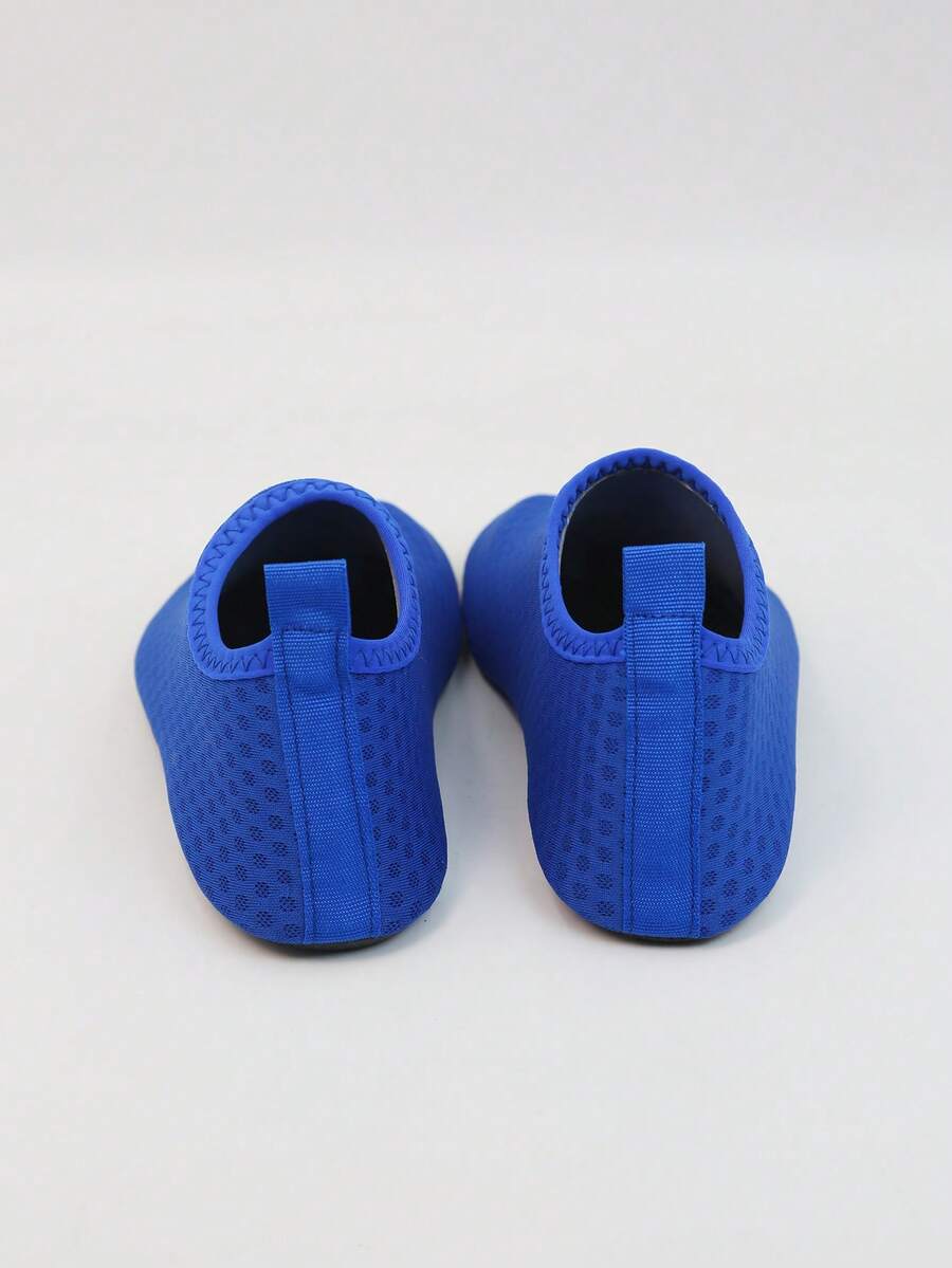 Kids slip-on aqua socks featuring geometric pattern, breathable Lycra upper, and non-slip TPR outsole for beach and water activities.