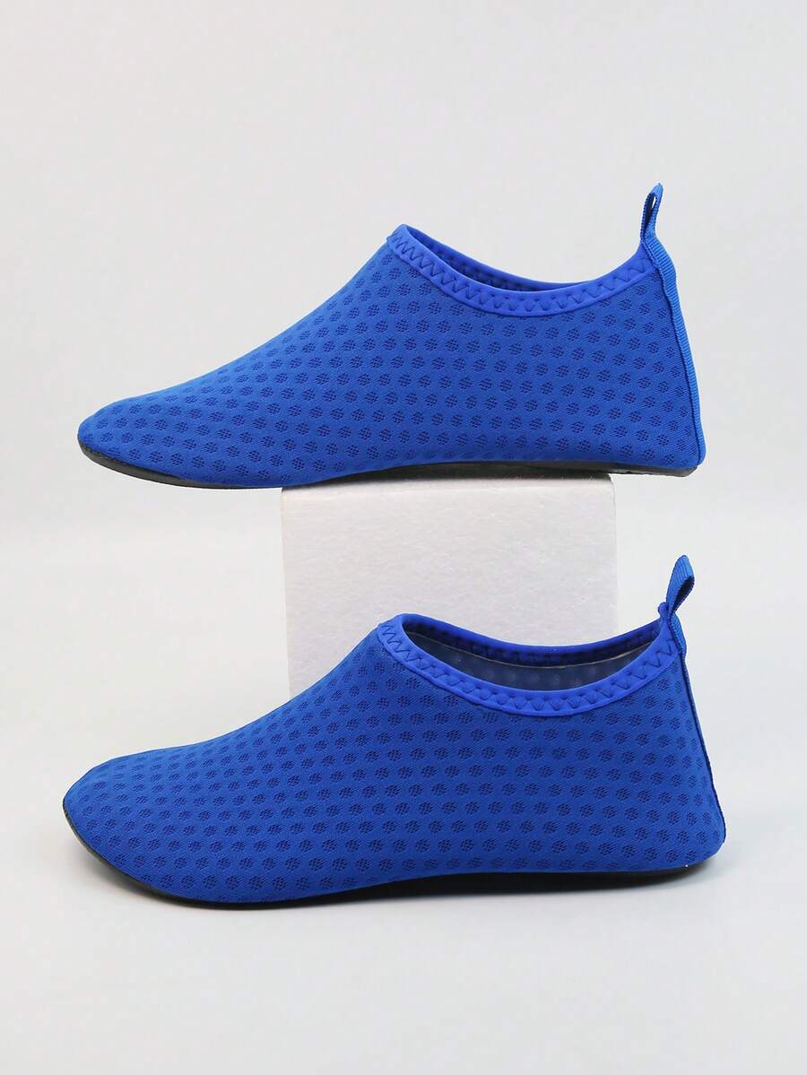 Kids slip-on aqua socks featuring geometric pattern, breathable Lycra upper, and non-slip TPR outsole for beach and water activities.