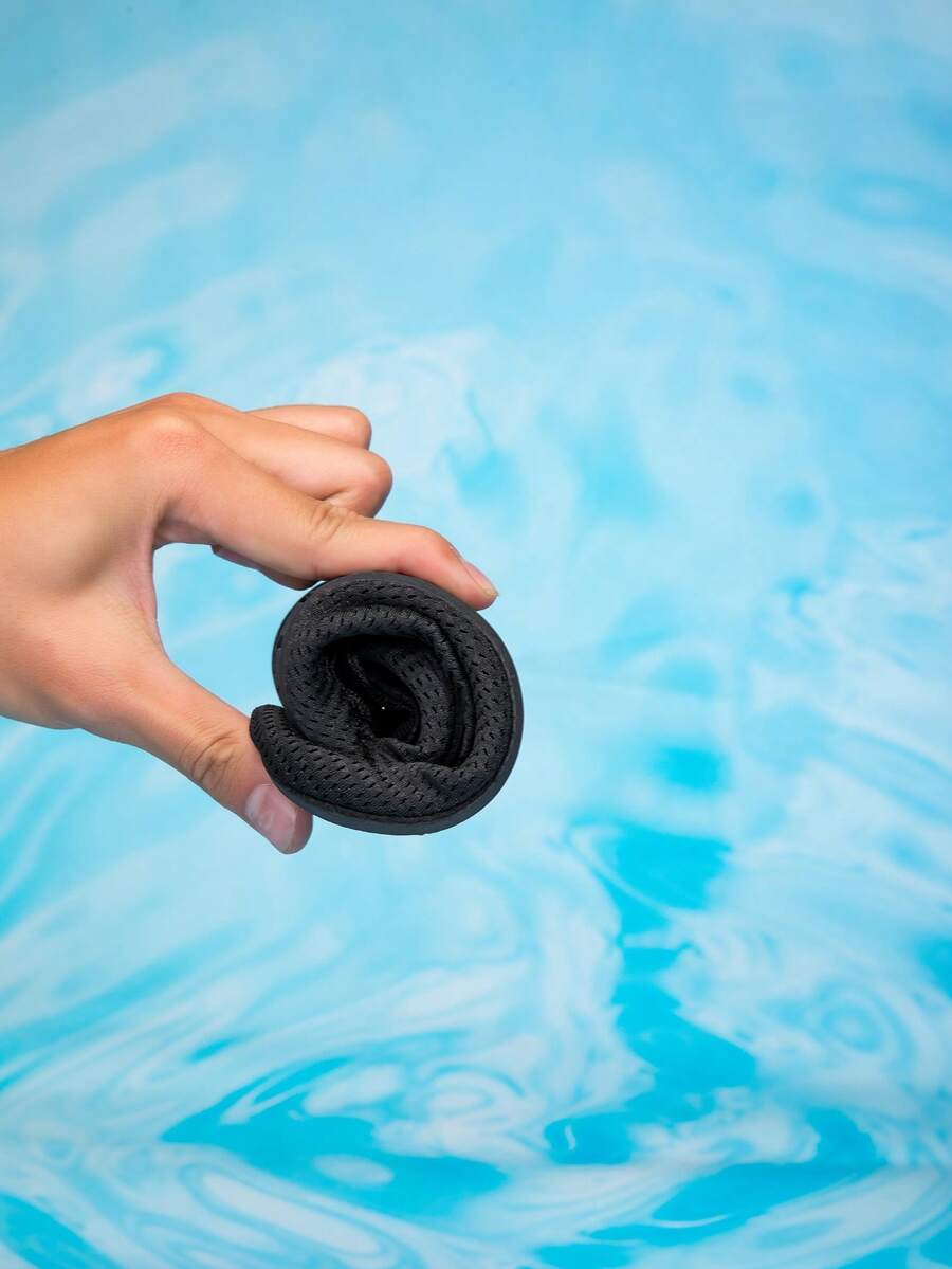Kids black slip-on water shoes featuring a breathable mesh upper and durable rubber outsole for boys and girls.