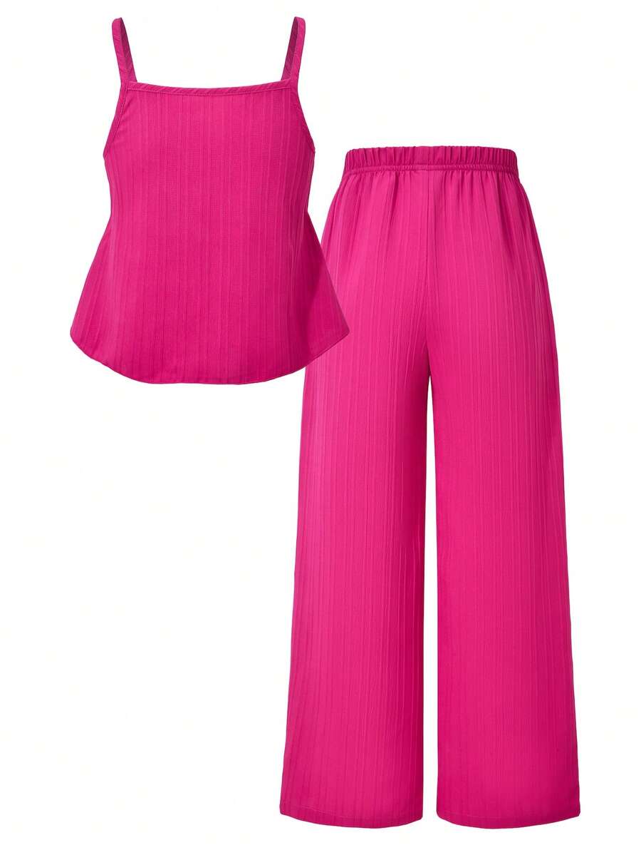 Tween girl wearing an apricot 2-piece outfit set featuring a shirred spaghetti strap short cami top and matching wide-leg long pants.